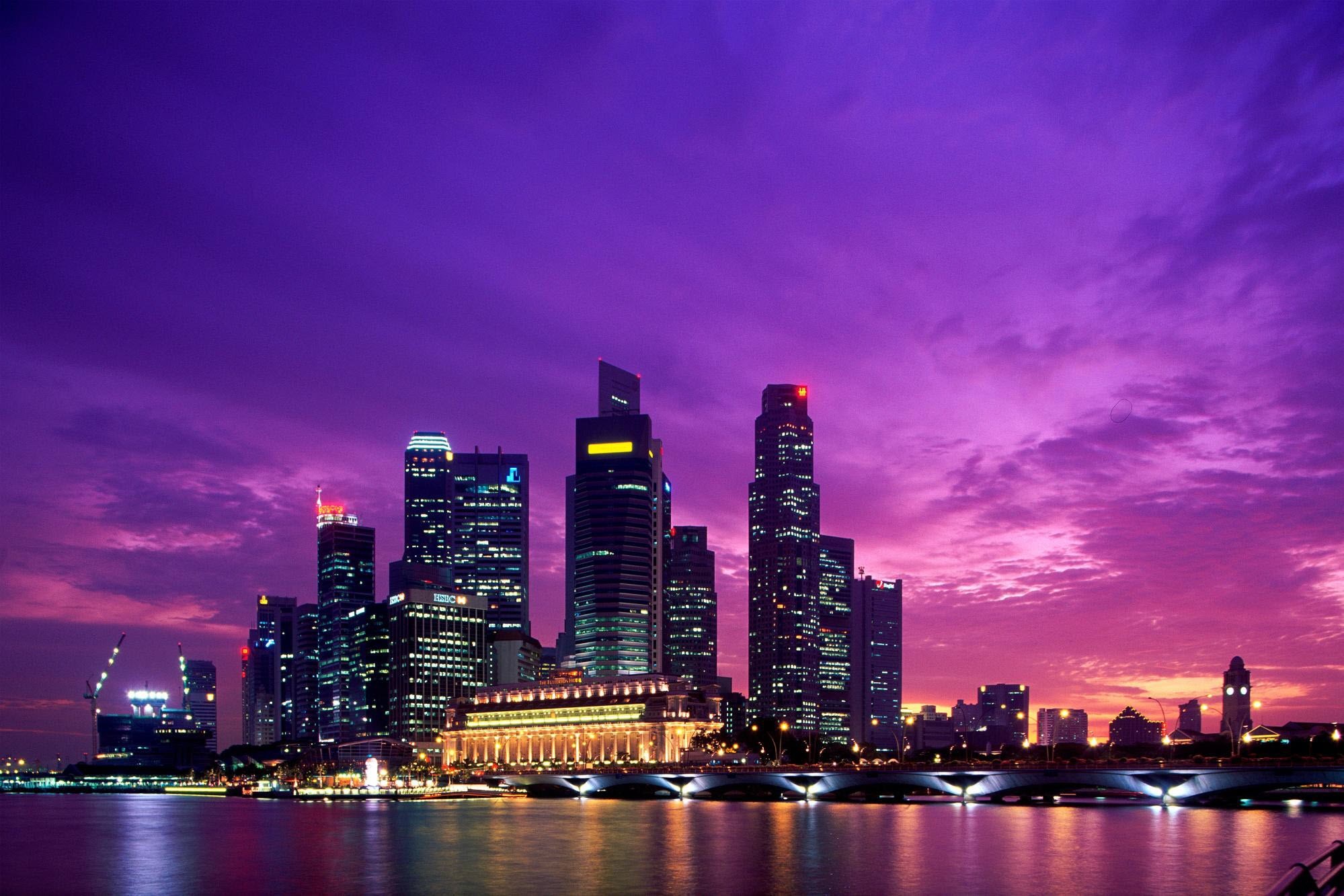 Singapore cityscape at sunset with skyscrapers and river HD Wallpaper