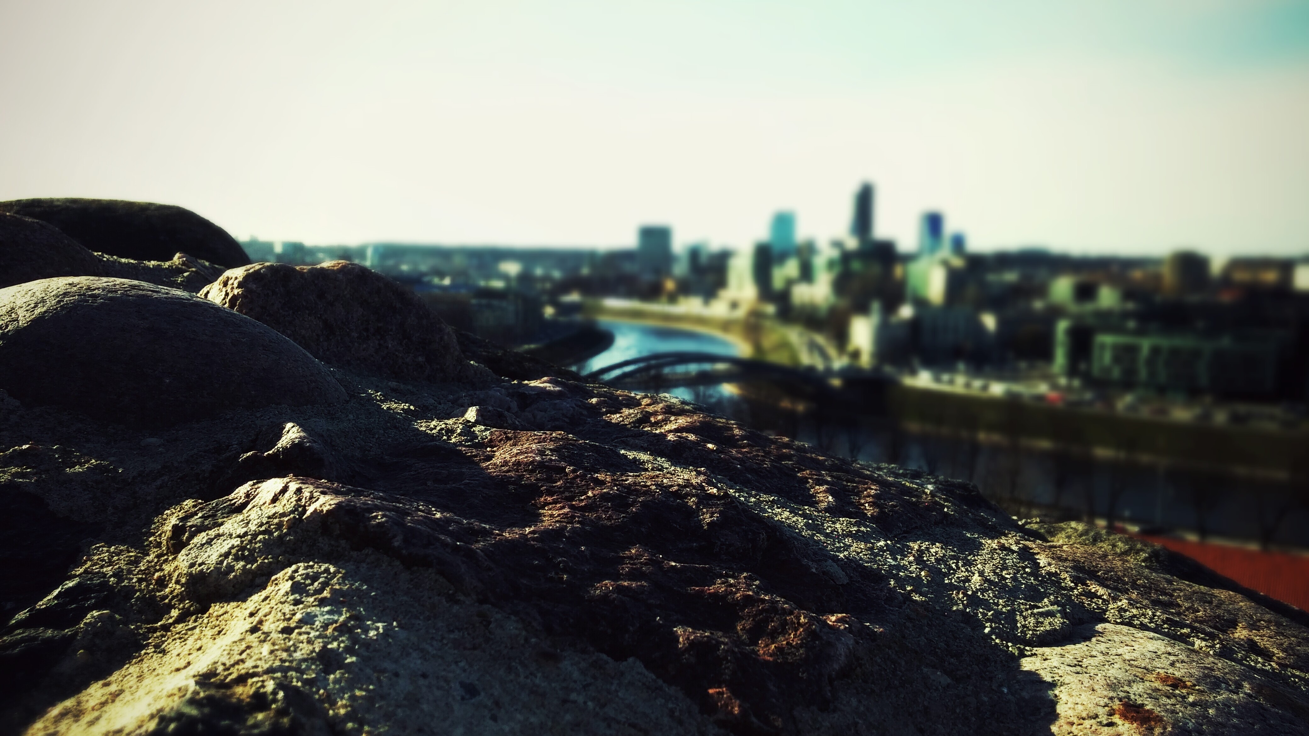 Vilnius cityscape with river and bridge from rocky viewpoint HD Wallpaper