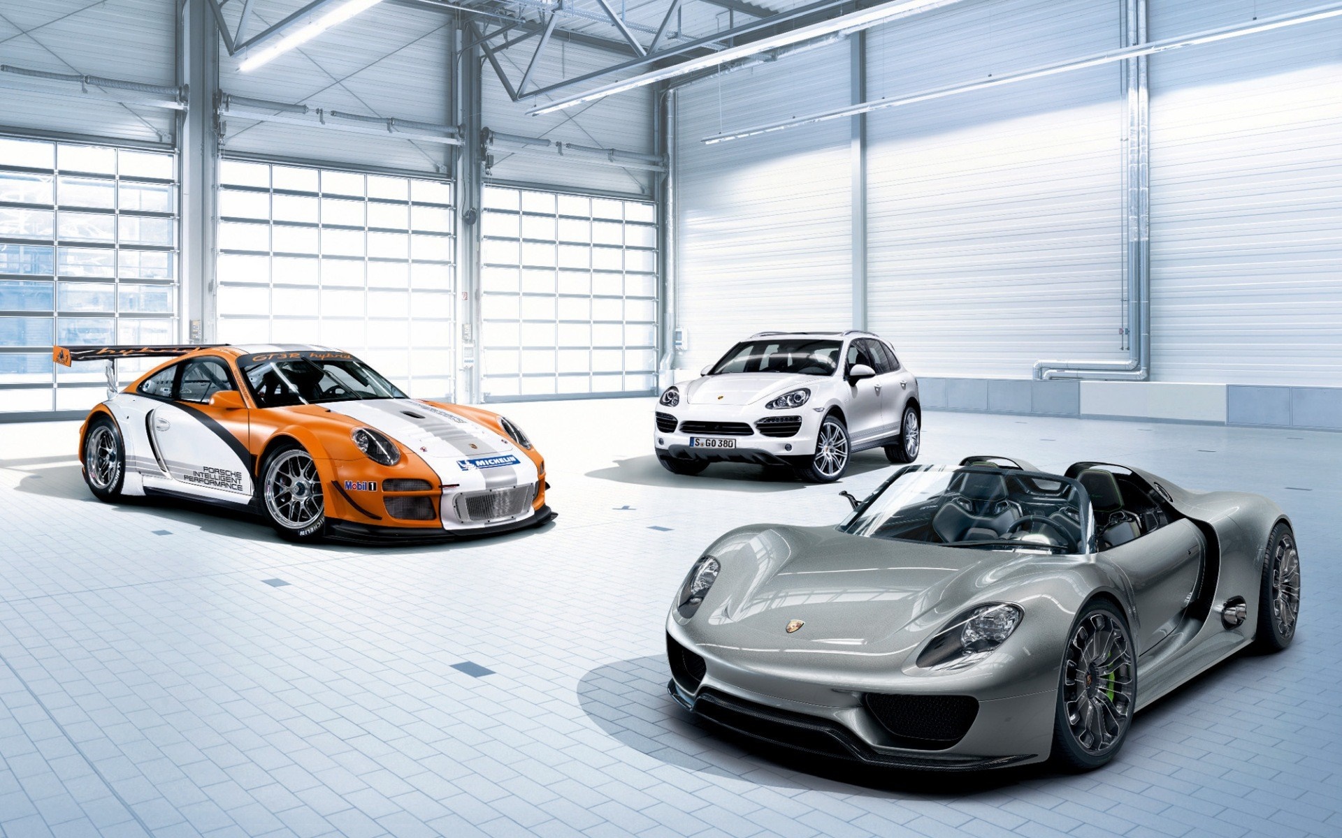 Porsche 911 GT3, 918 Spyder, and Cayenne in garage HD Wallpaper