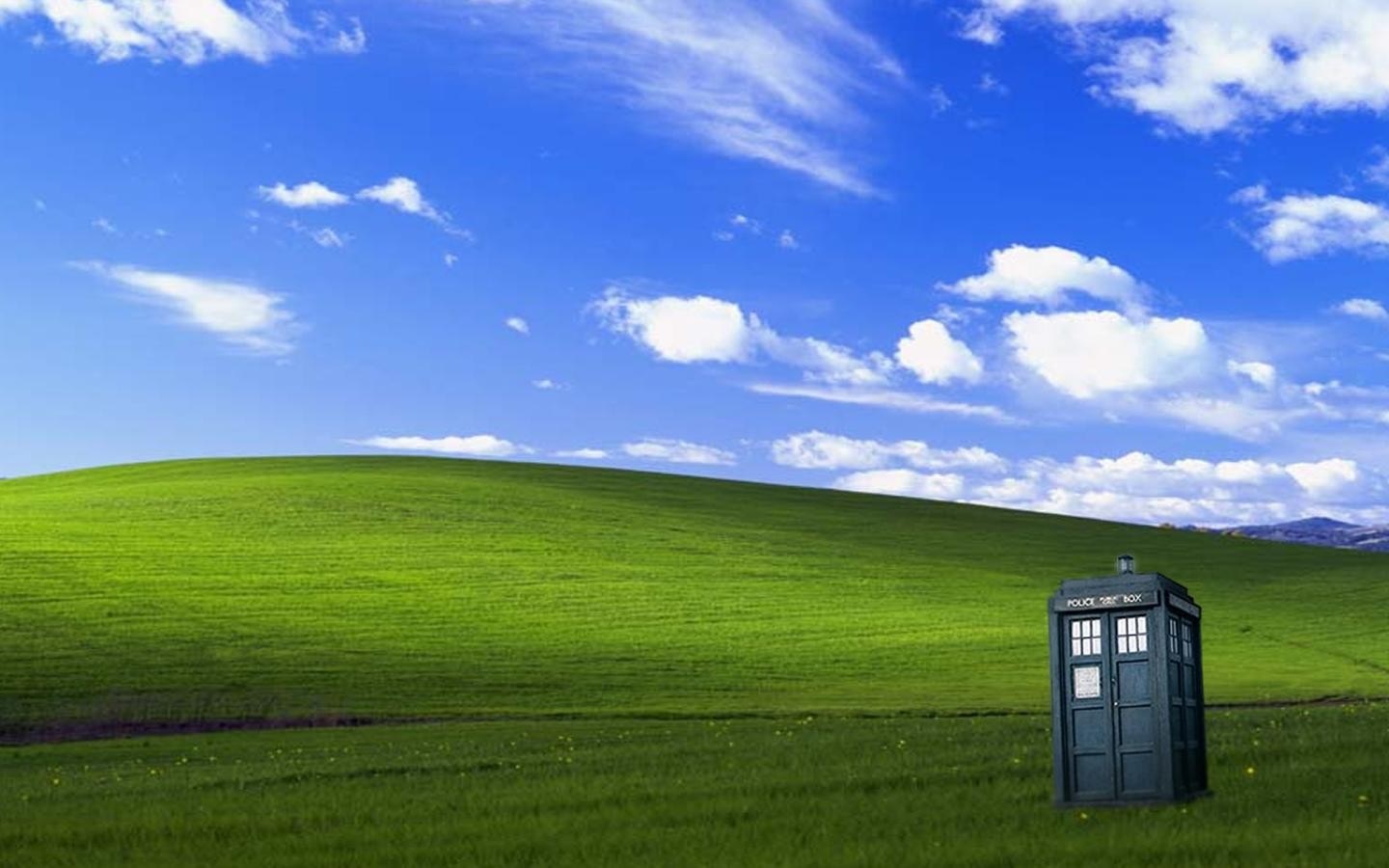 TARDIS from Doctor Who in a green landscape HD Wallpaper