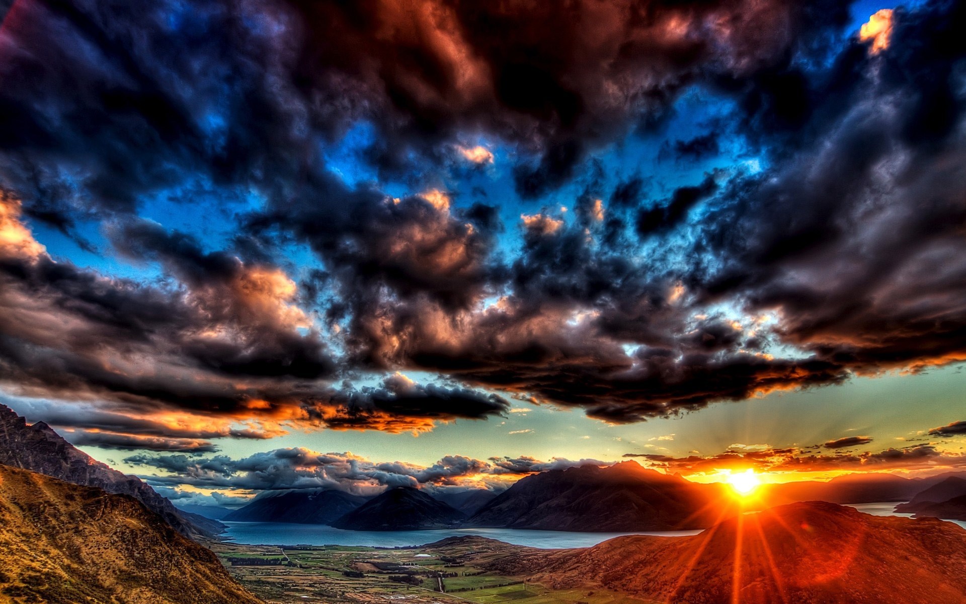 Dramatic sunset over mountains and lake HD Wallpaper