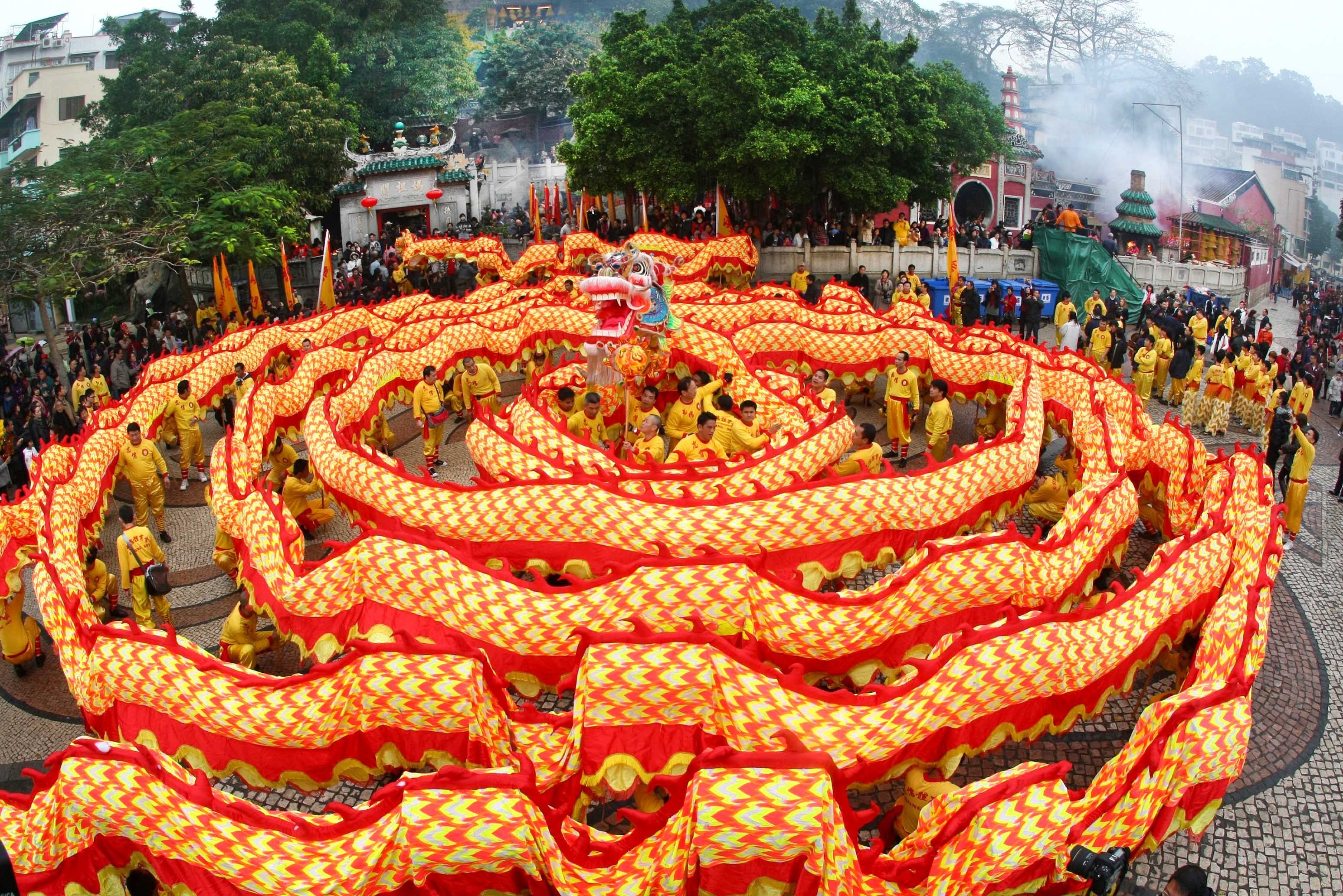 Dragon Dance Performance During Chinese New Year Celebration HD Wallpaper