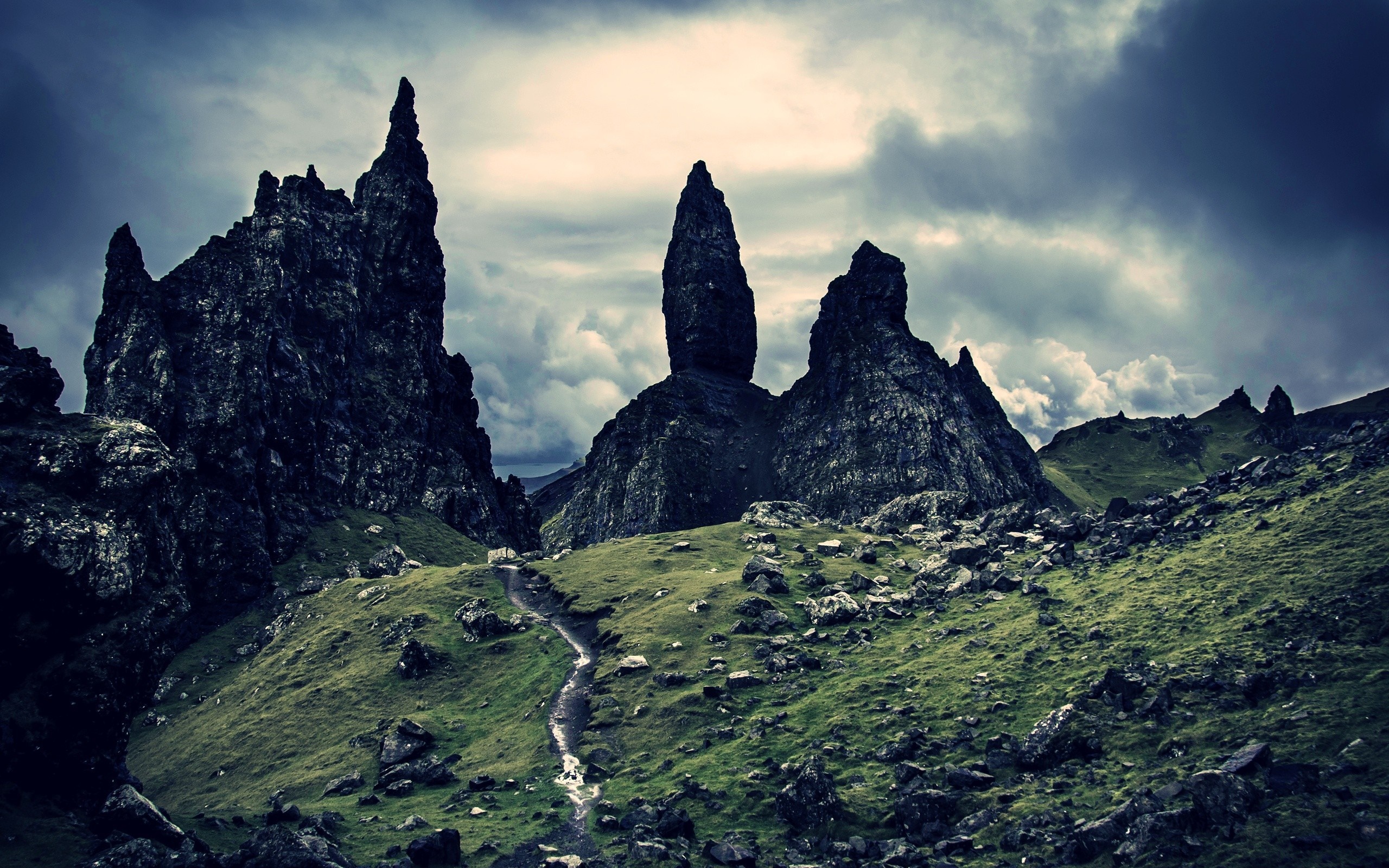 Dramatic rocky landscape with a winding path HD Wallpaper