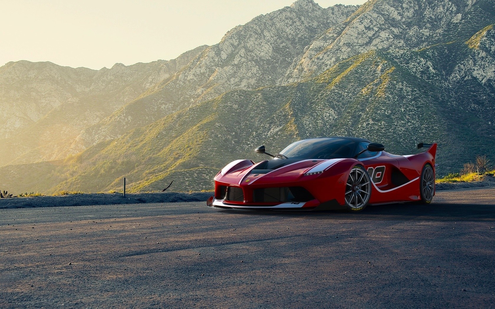 Red Ferrari FXX K Evo parked on a mountain road HD Wallpaper