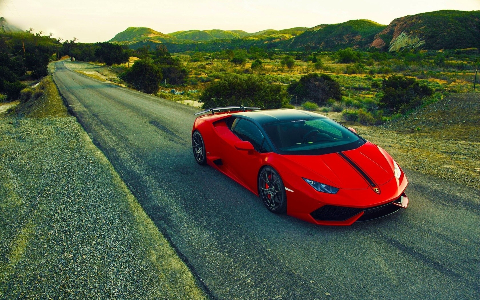 Red Lamborghini Huracan on a winding road HD Wallpaper