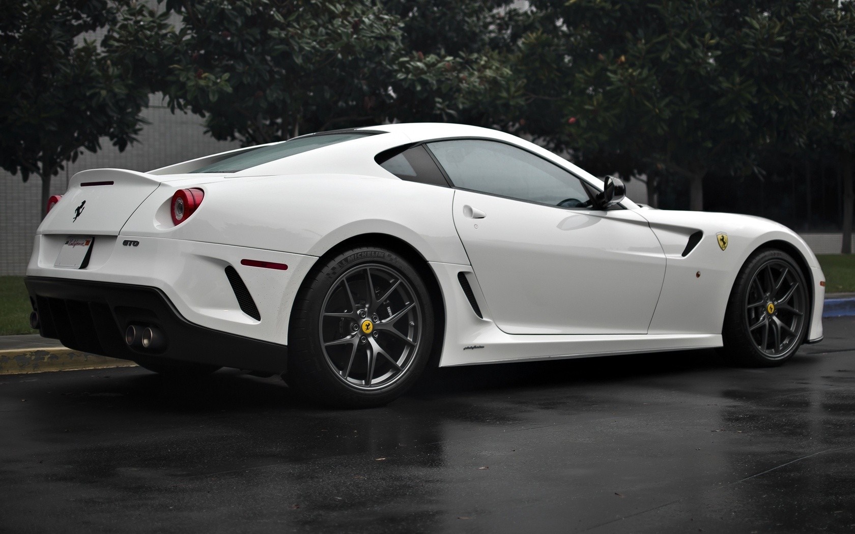 White Ferrari 599 GTO parked on wet asphalt HD Wallpaper