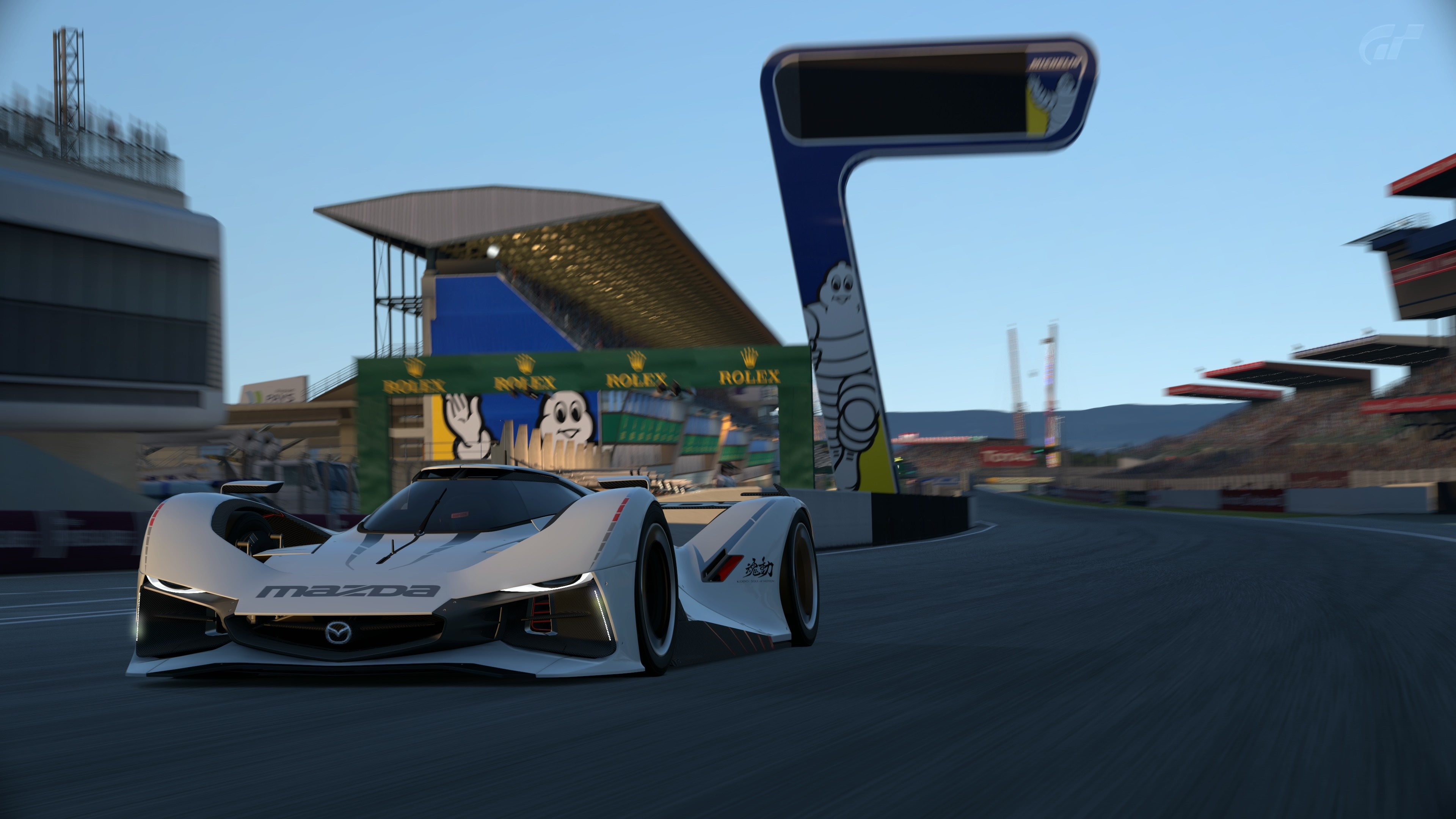 Mazda LM55 Vision Gran Turismo on a race track HD Wallpaper