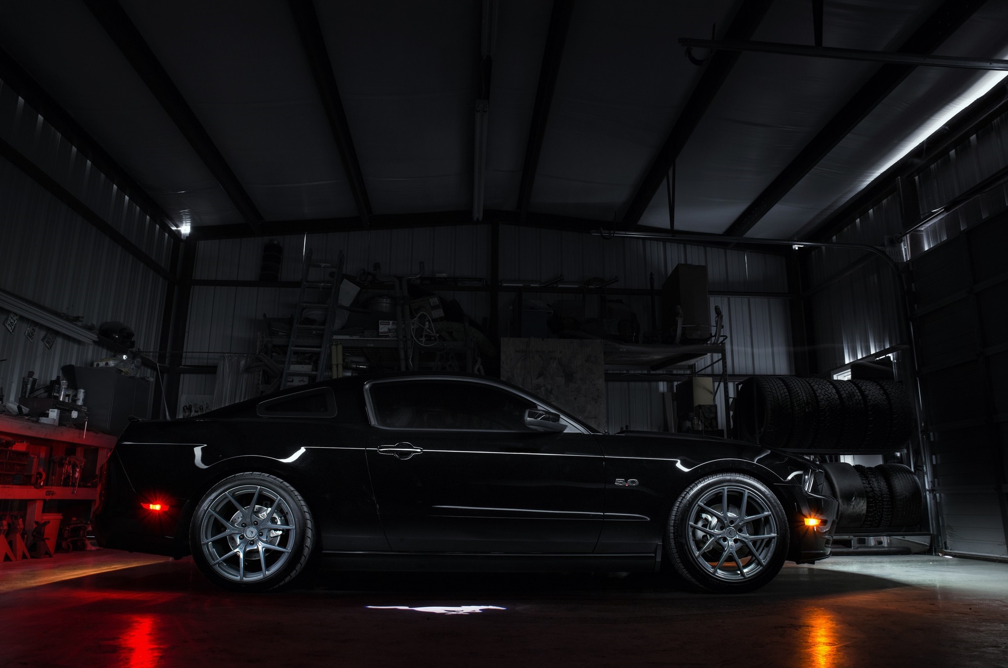 Black Ford Mustang GT parked in a garage HD Wallpaper