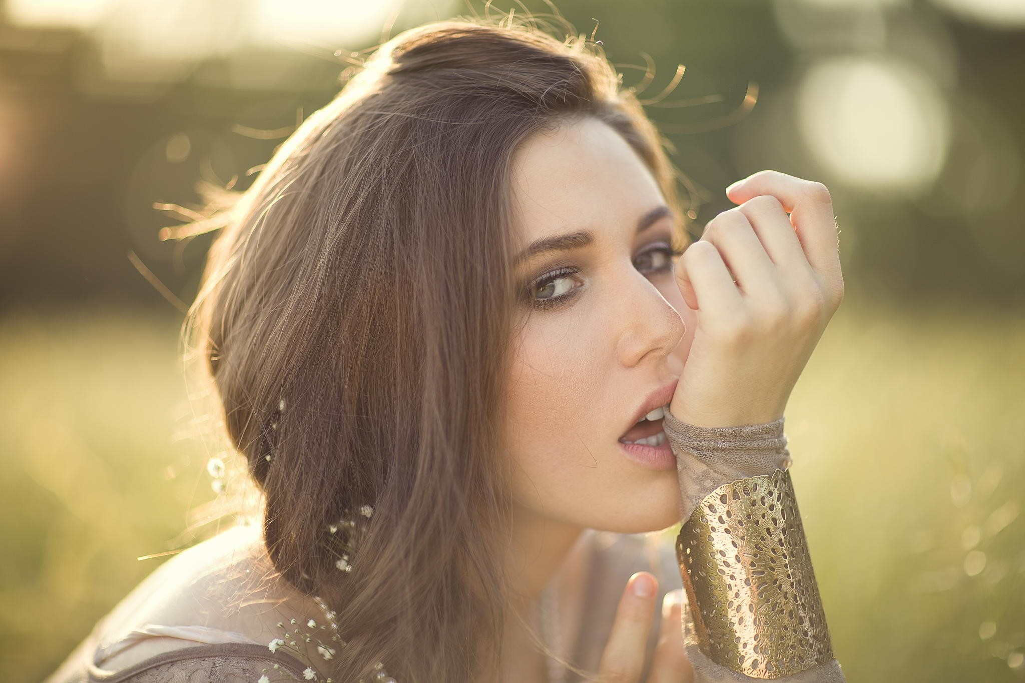 Woman with brown hair and golden cuff HD Wallpaper