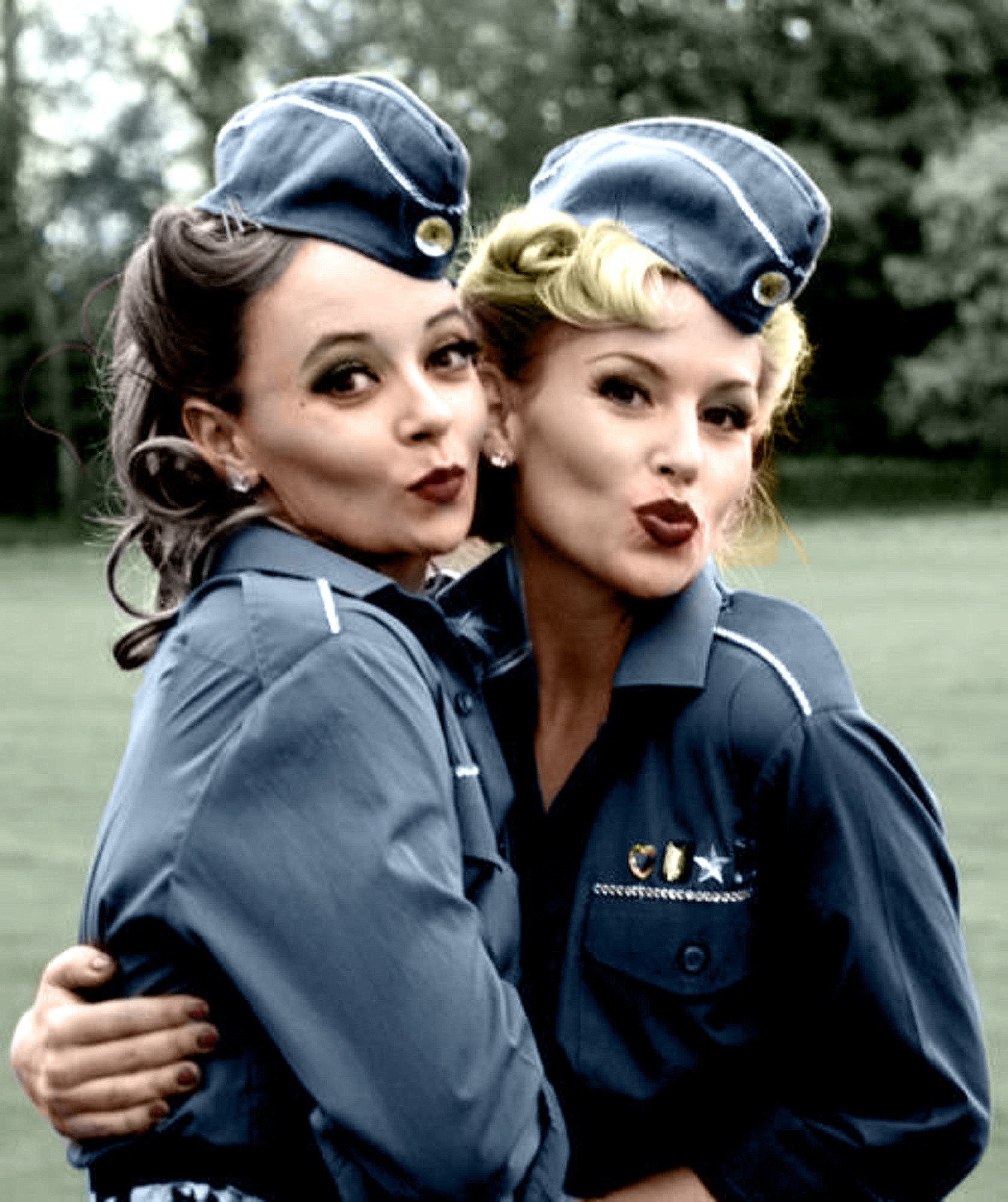 Two women in vintage military uniforms posing HD Wallpaper
