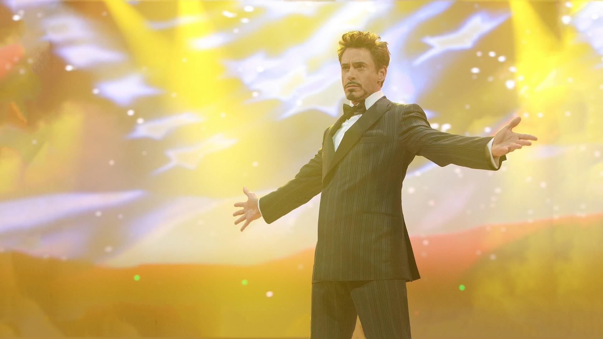 Tony Stark in a suit on stage HD Wallpaper