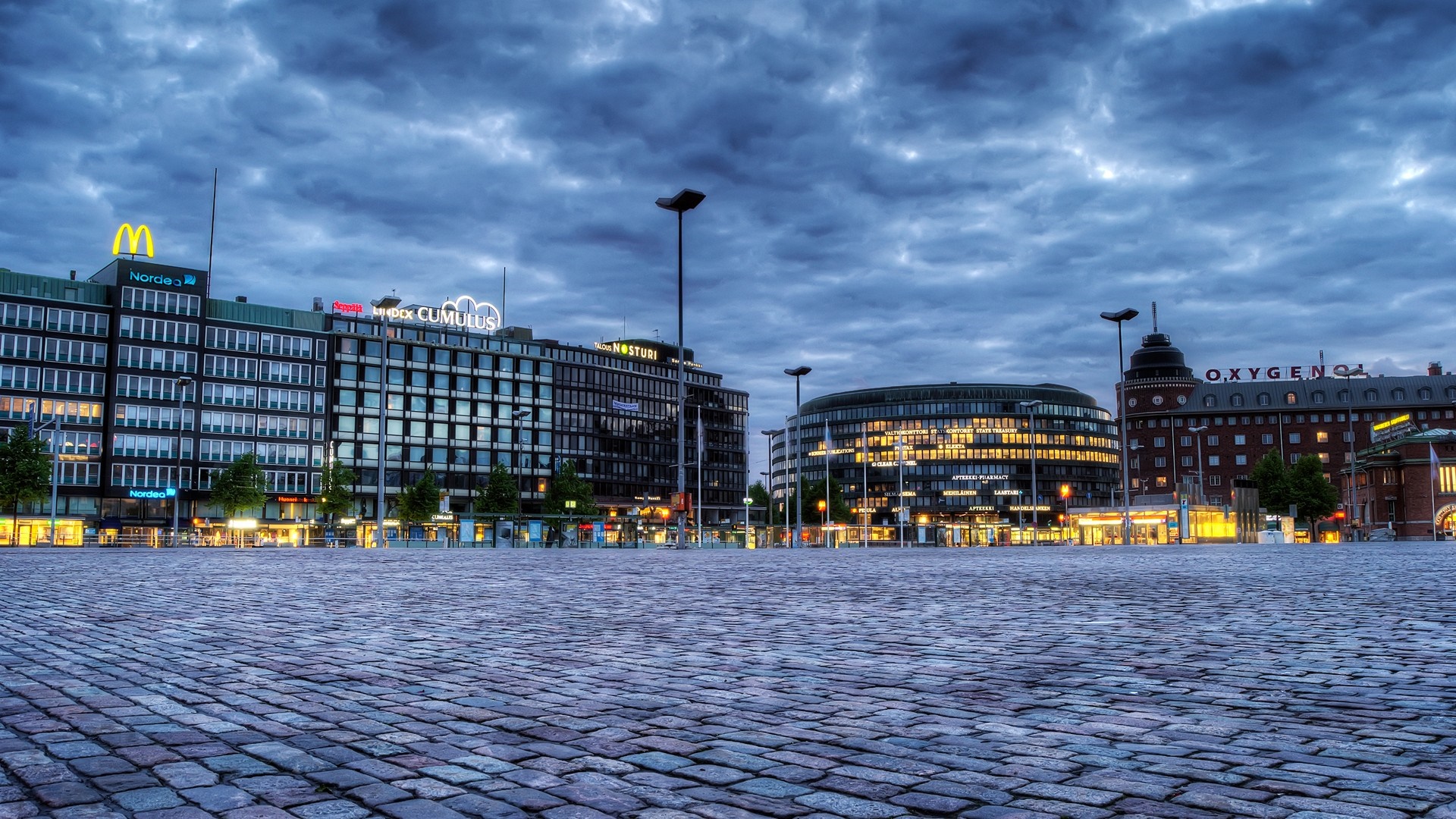 Hakaniemen tori square at dusk with buildings and clouds HD Wallpaper