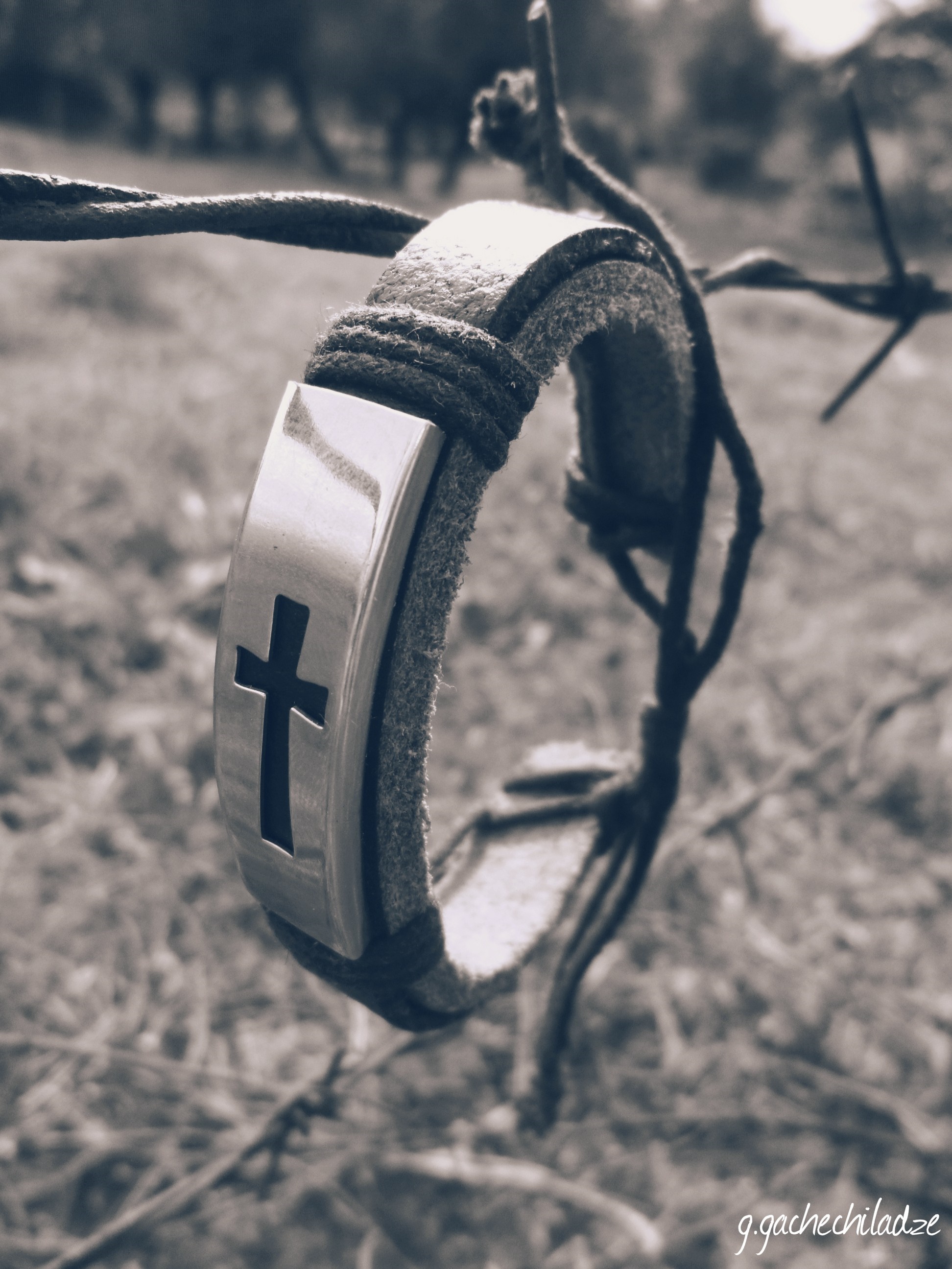 Leather bracelet with cross on barbed wire HD Wallpaper
