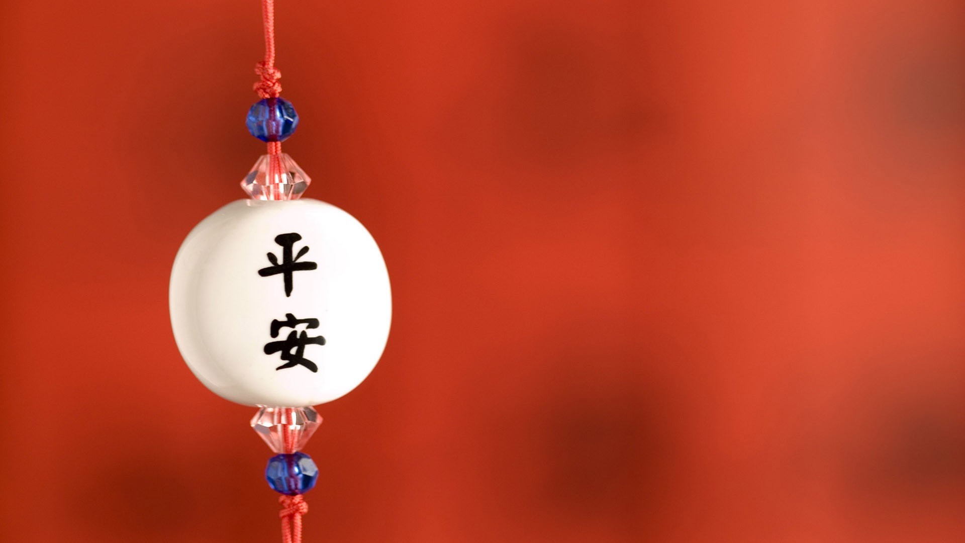 Chinese characters for peace on a white ornament HD Wallpaper