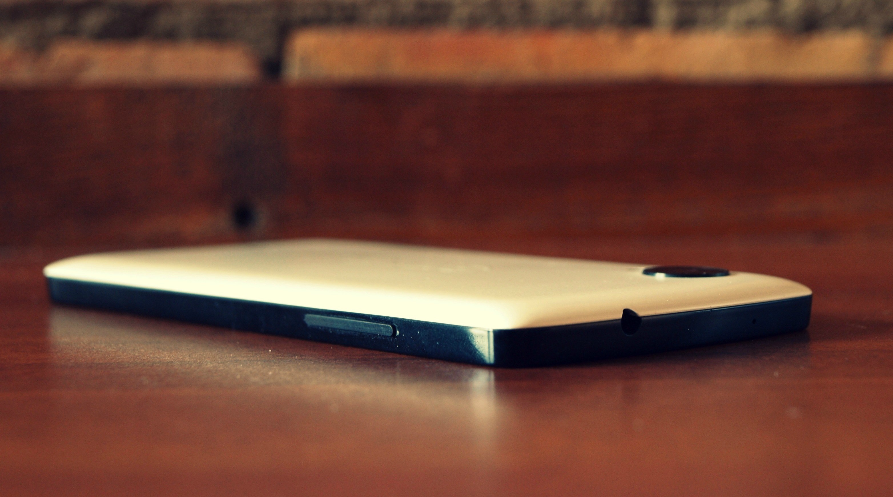 Nexus 5 smartphone on a wooden table HD Wallpaper