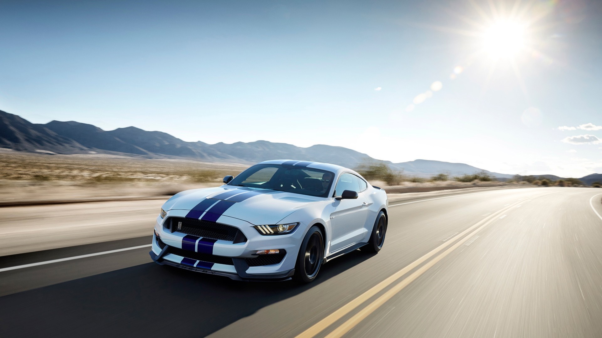 White Ford Mustang Shelby GT350 driving on a desert road HD Wallpaper