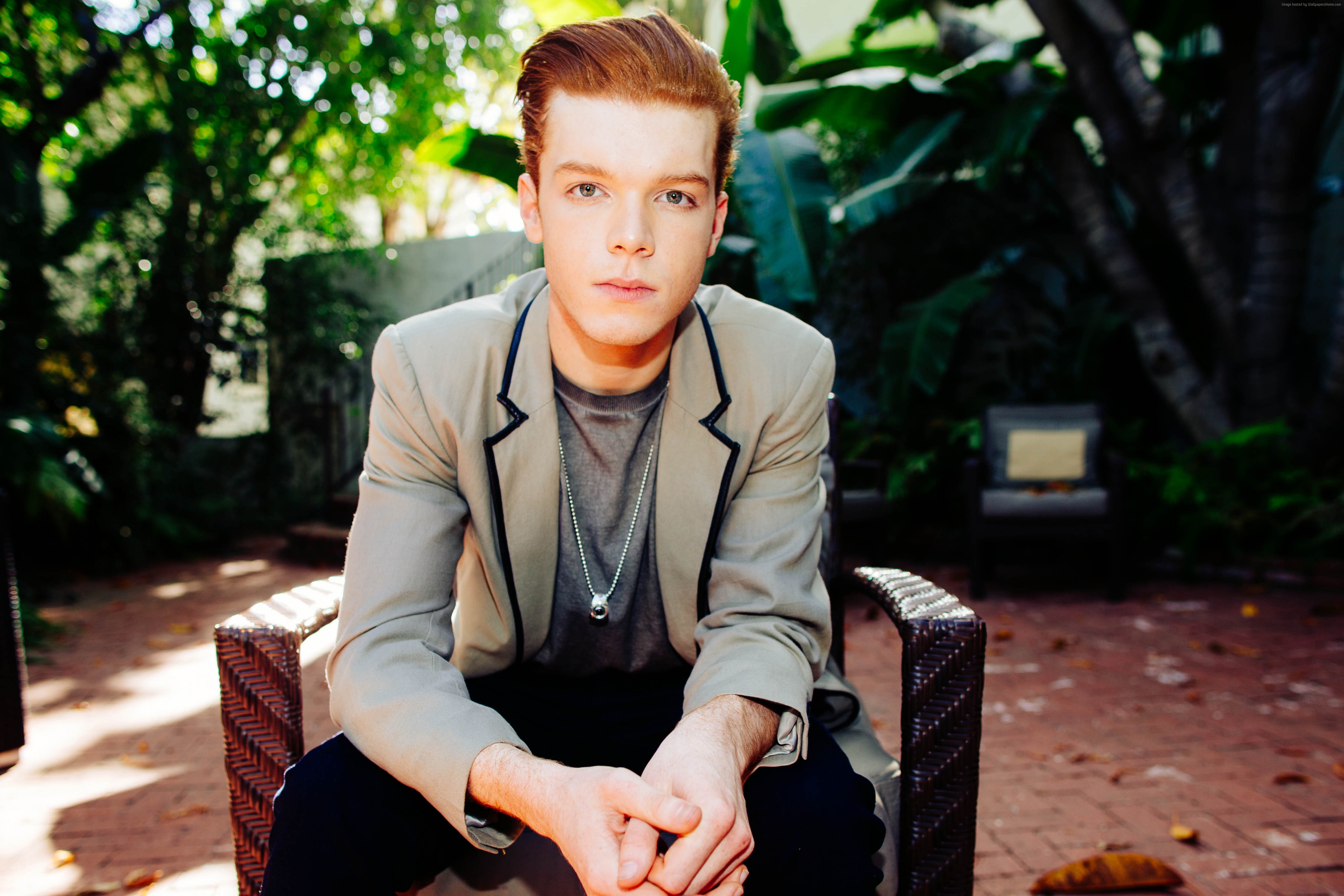 Cameron Monaghan sitting outdoors HD Wallpaper