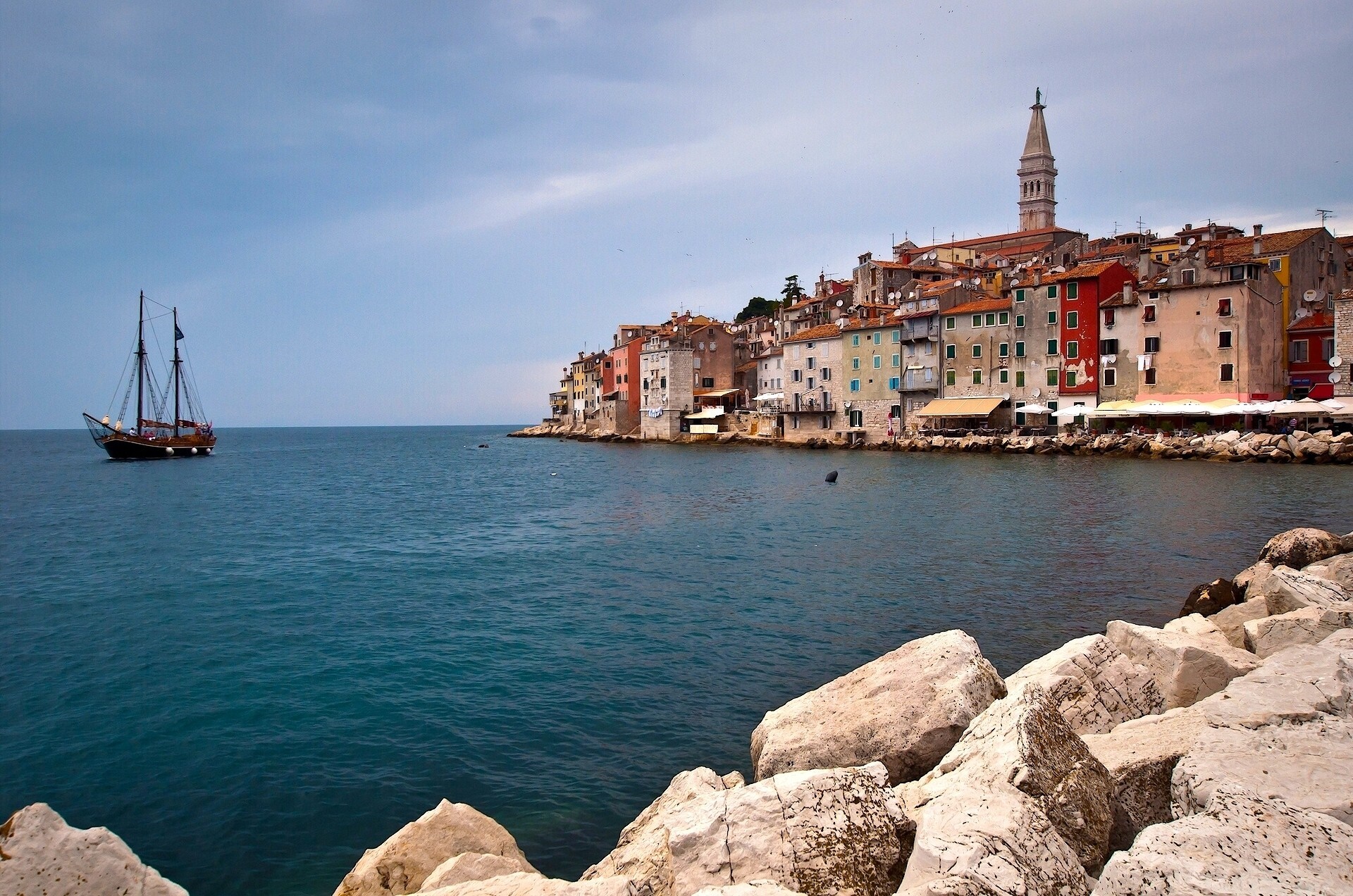 Sailing ship near Rovinj cityscape with church tower, Croatia HD Wallpaper