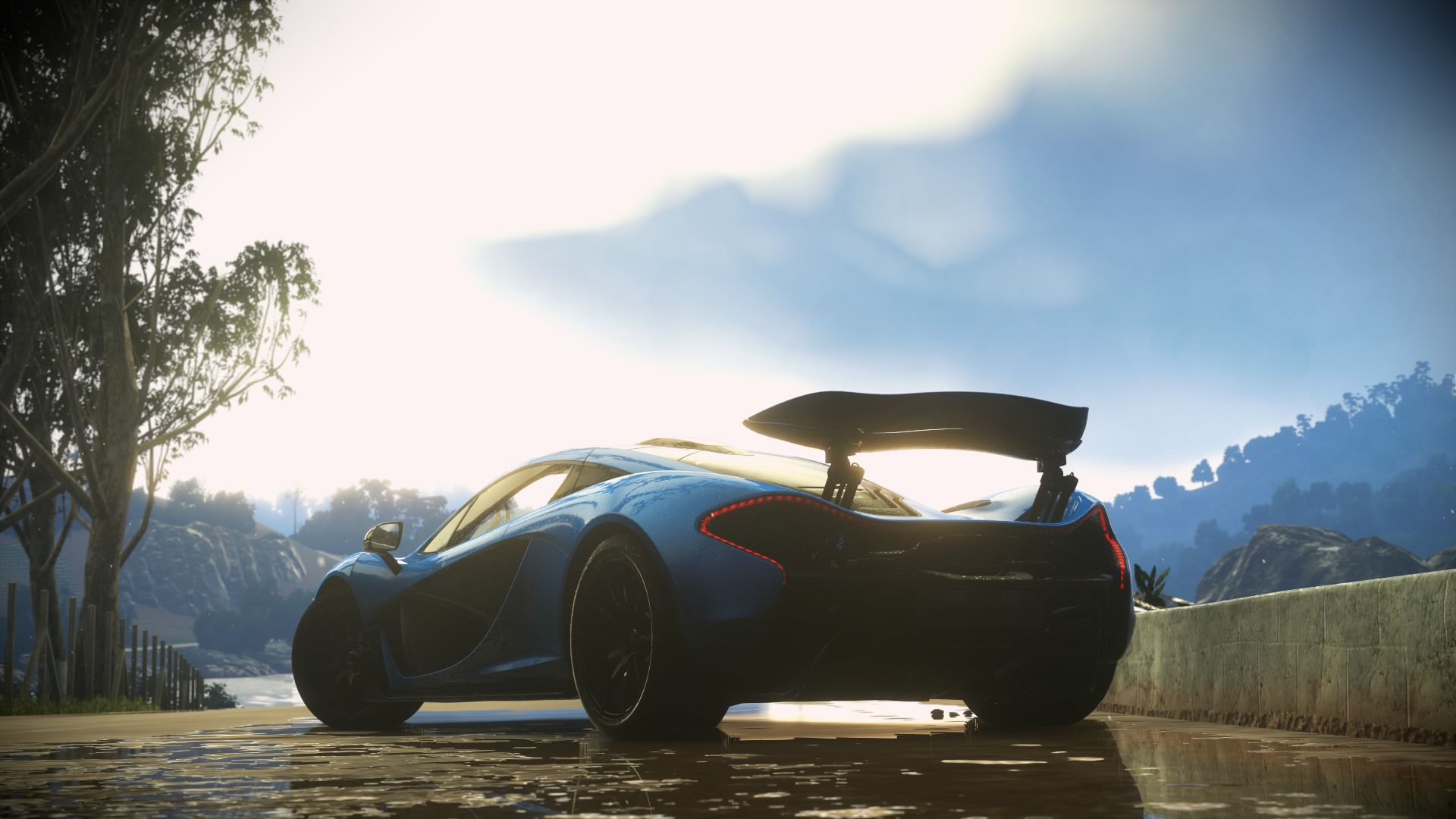 McLaren P1 sports car on a wet road HD Wallpaper