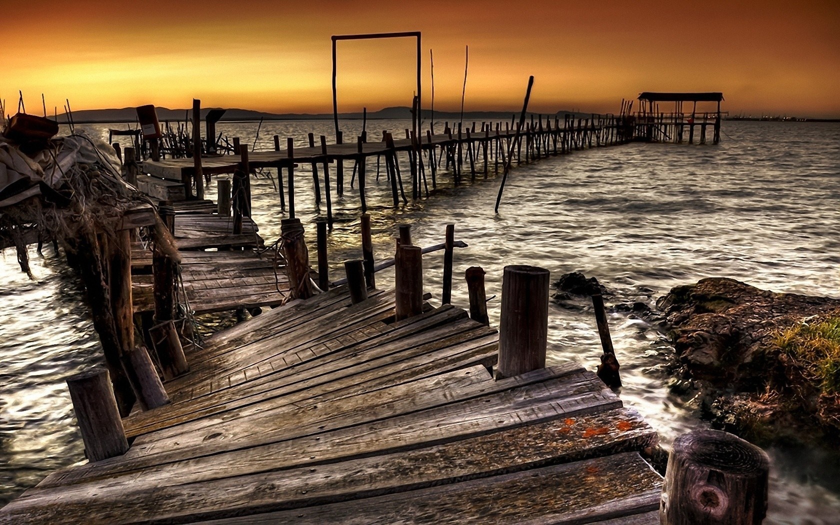 Old wooden pier at sunset over the sea HD Wallpaper