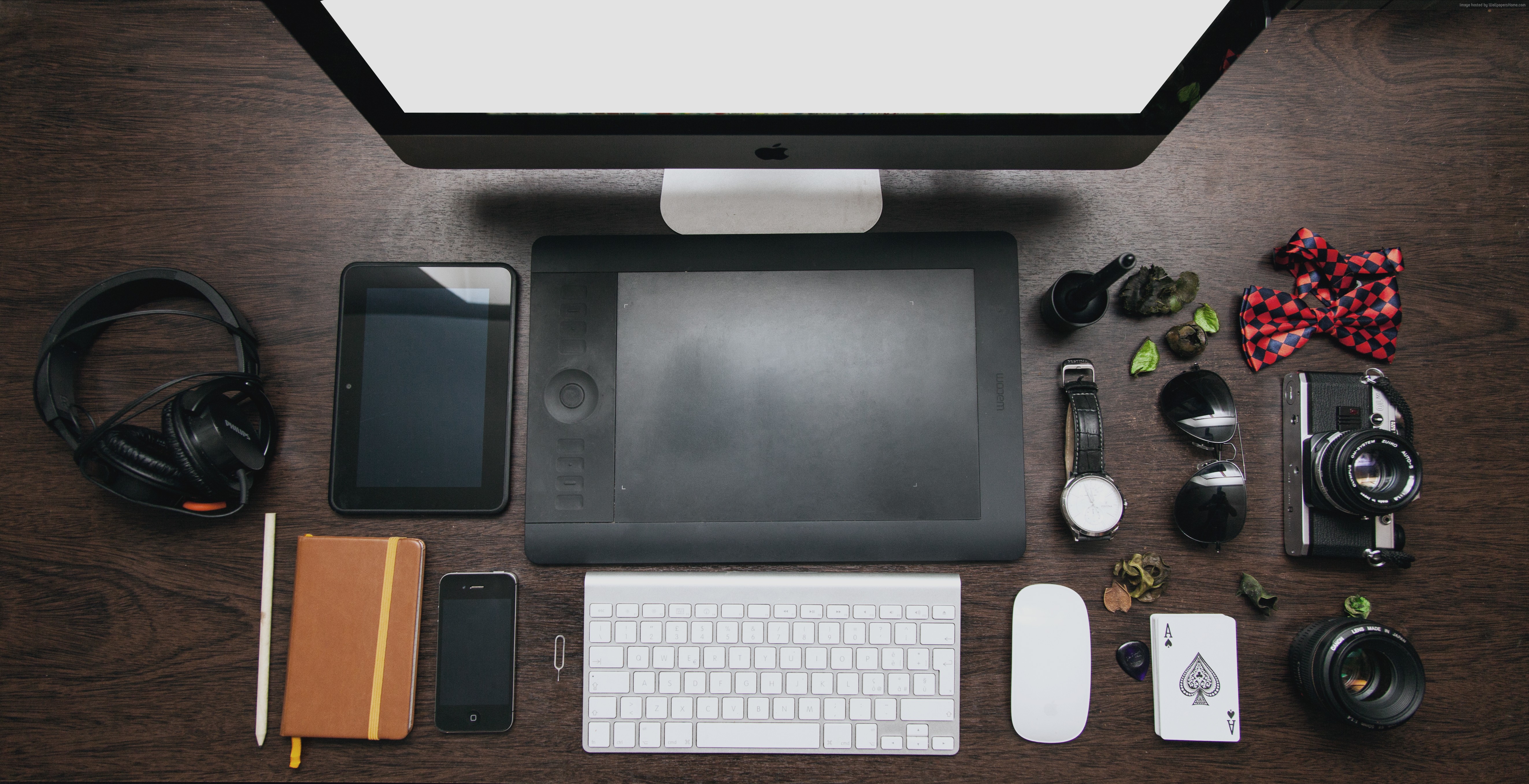 Desk setup with iMac, Wacom tablet, and accessories HD Wallpaper