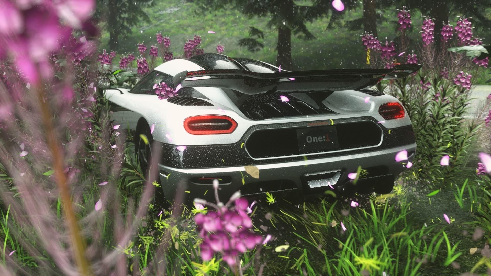 Koenigsegg One:1 sports car in a forest setting HD Wallpaper