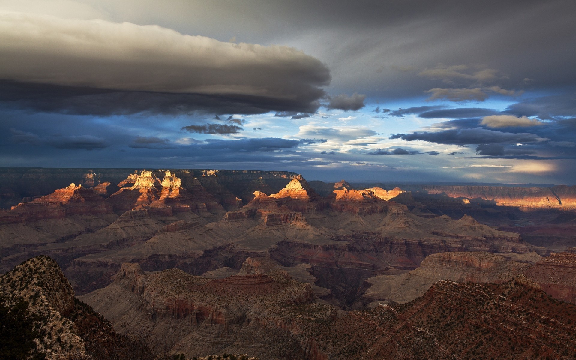 Grand Canyon at sunset with dramatic clouds HD Wallpaper