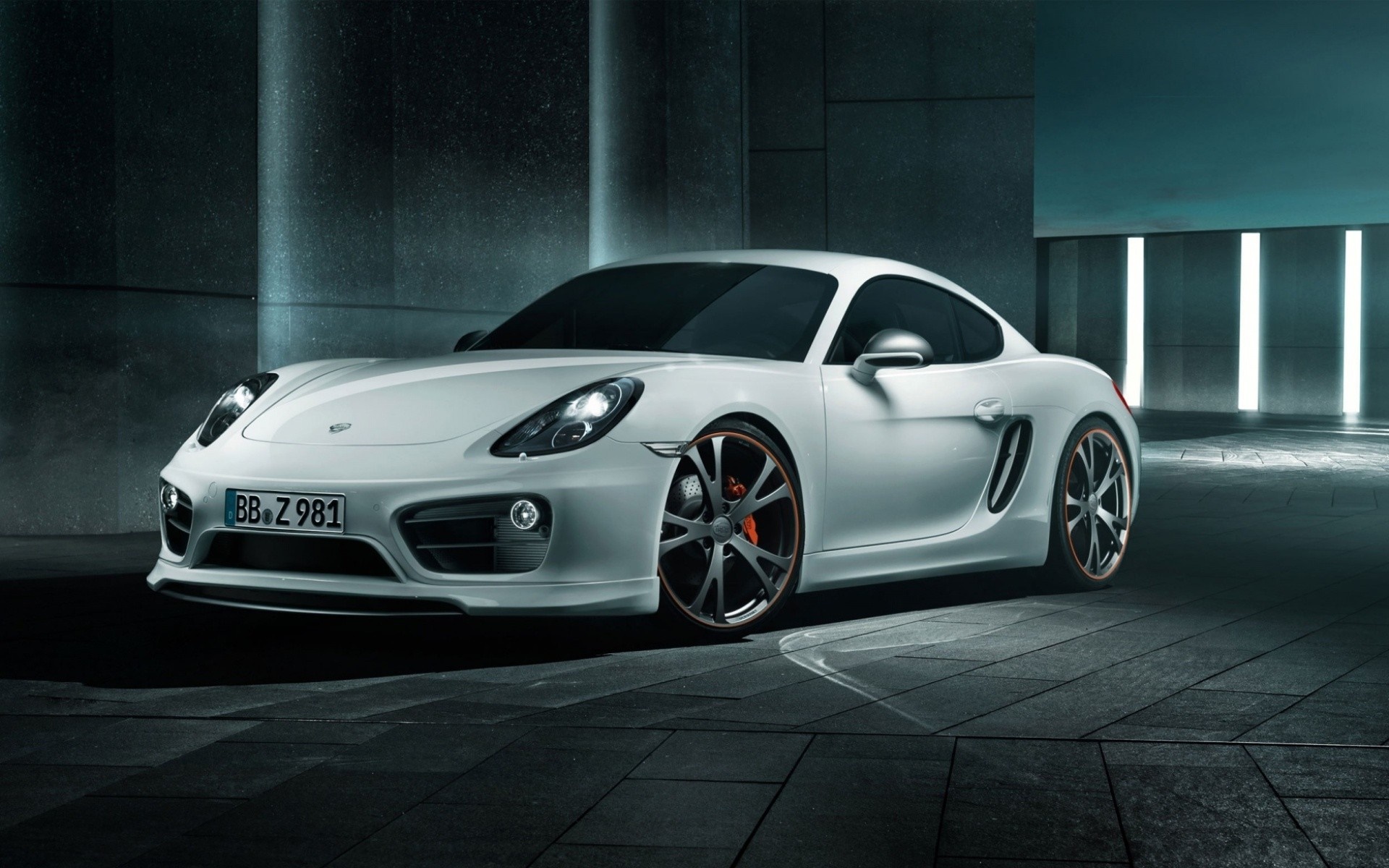 White Porsche Cayman S parked in a modern garage HD Wallpaper