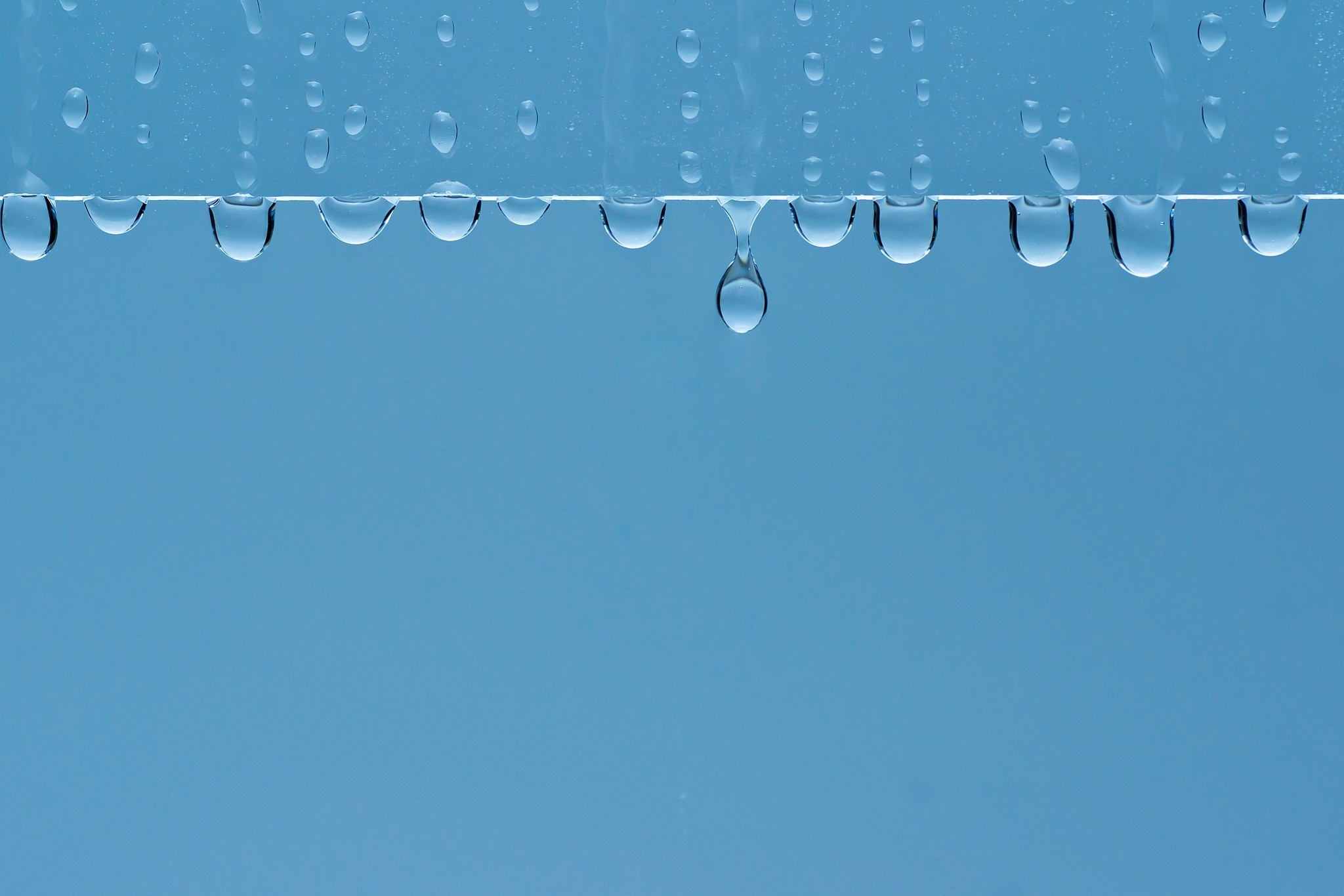 Water drops on a blue background HD Wallpaper