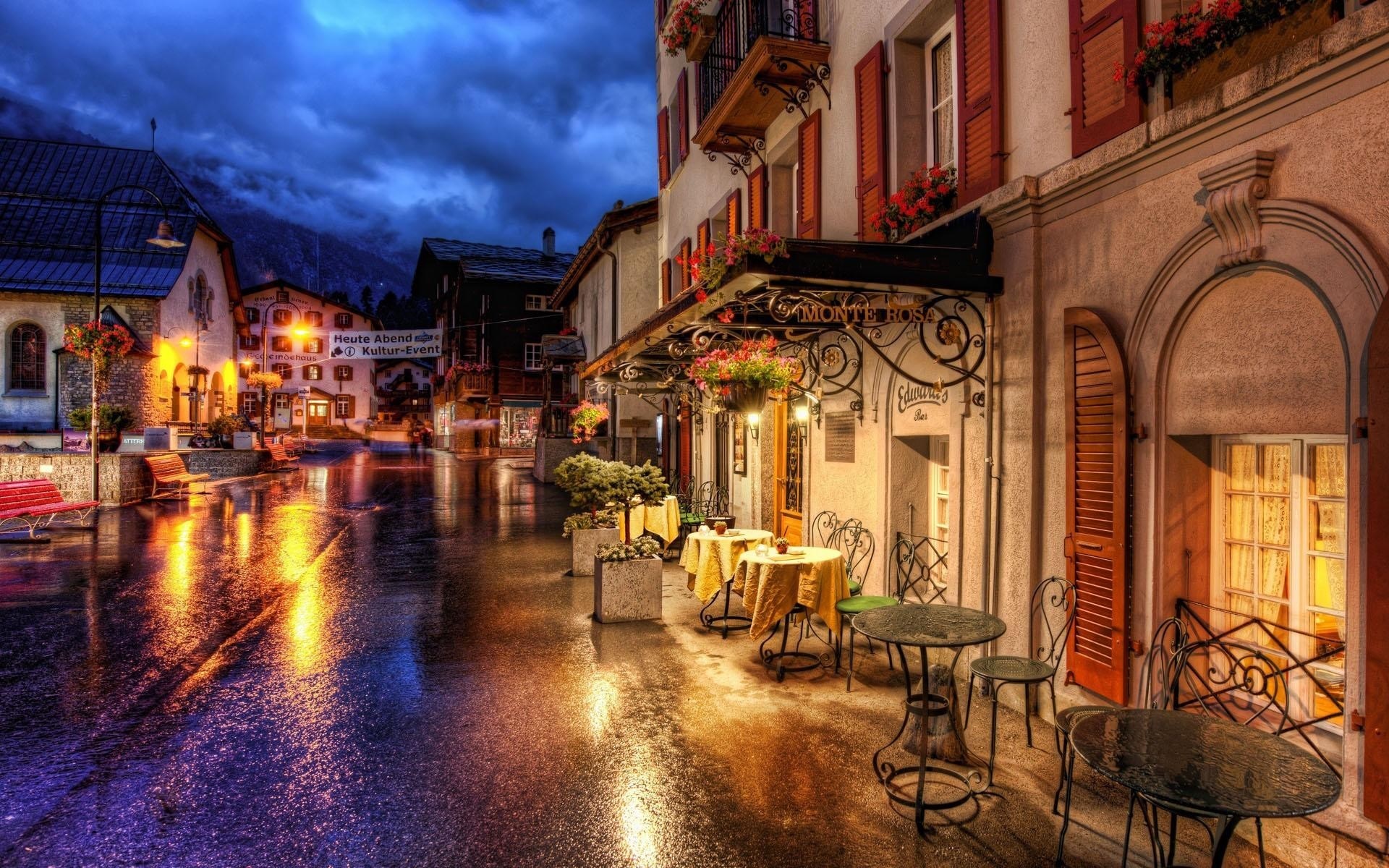 Street scene in a European town at night after rain HD Wallpaper