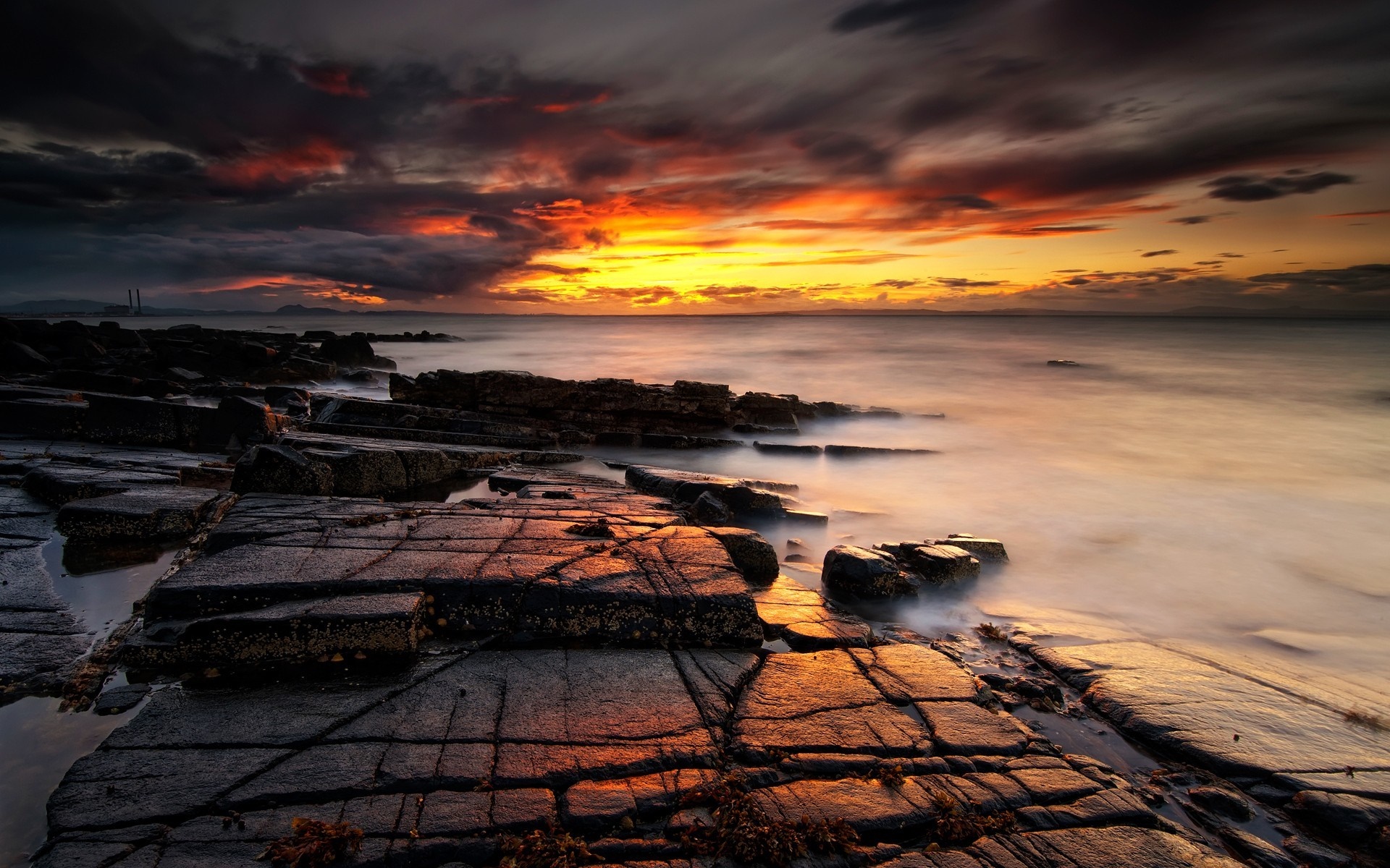 Sunset over rocky shore with ocean waves HD Wallpaper