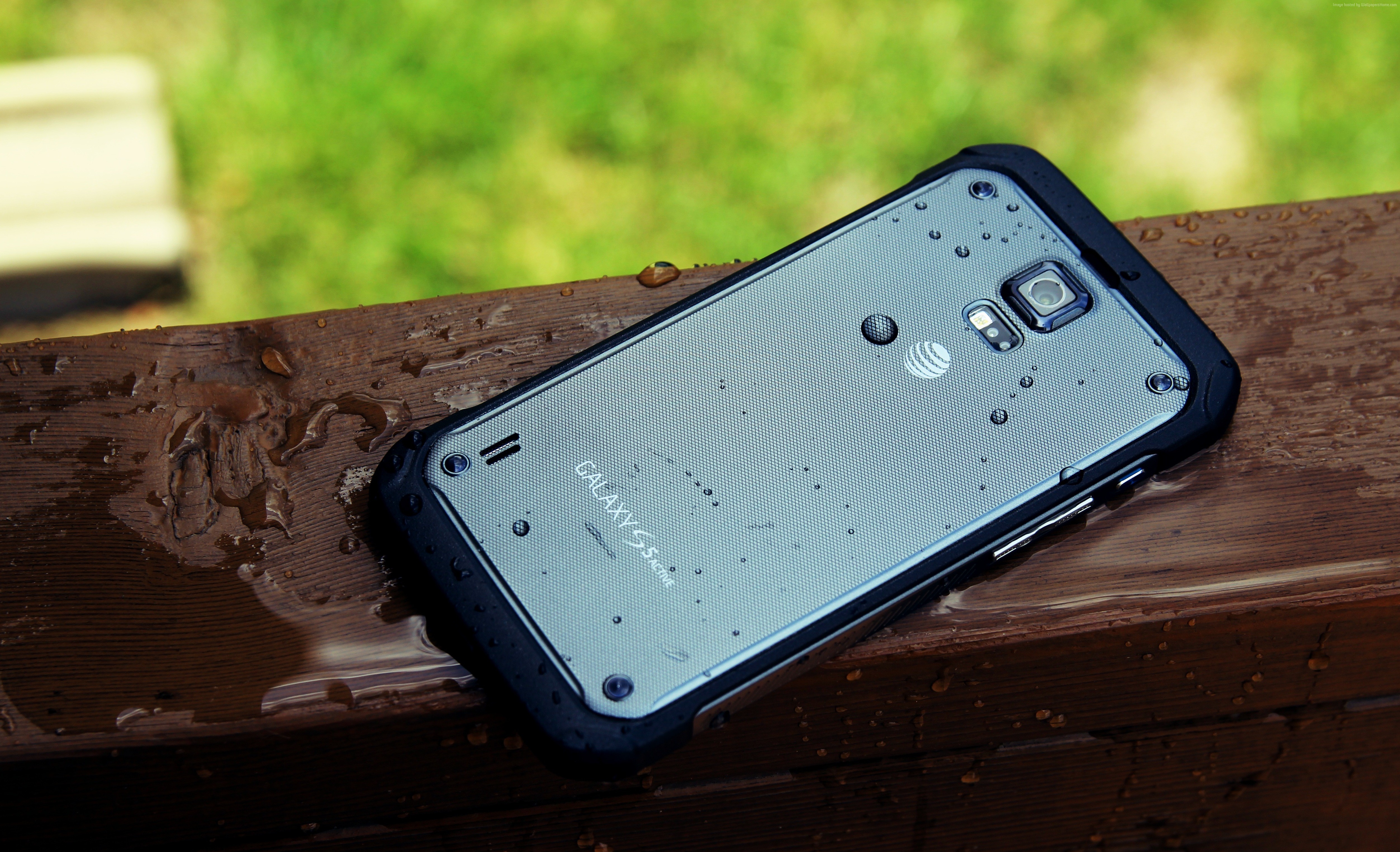 Samsung Galaxy S6 Active on a wet wooden surface HD Wallpaper