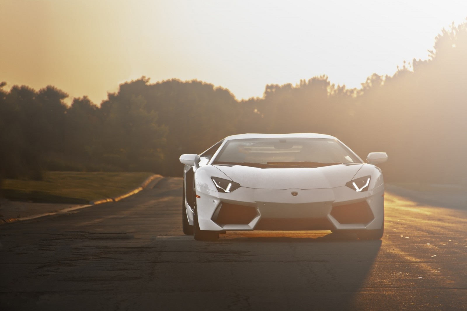 White Lamborghini Aventador on a road at sunset HD Wallpaper