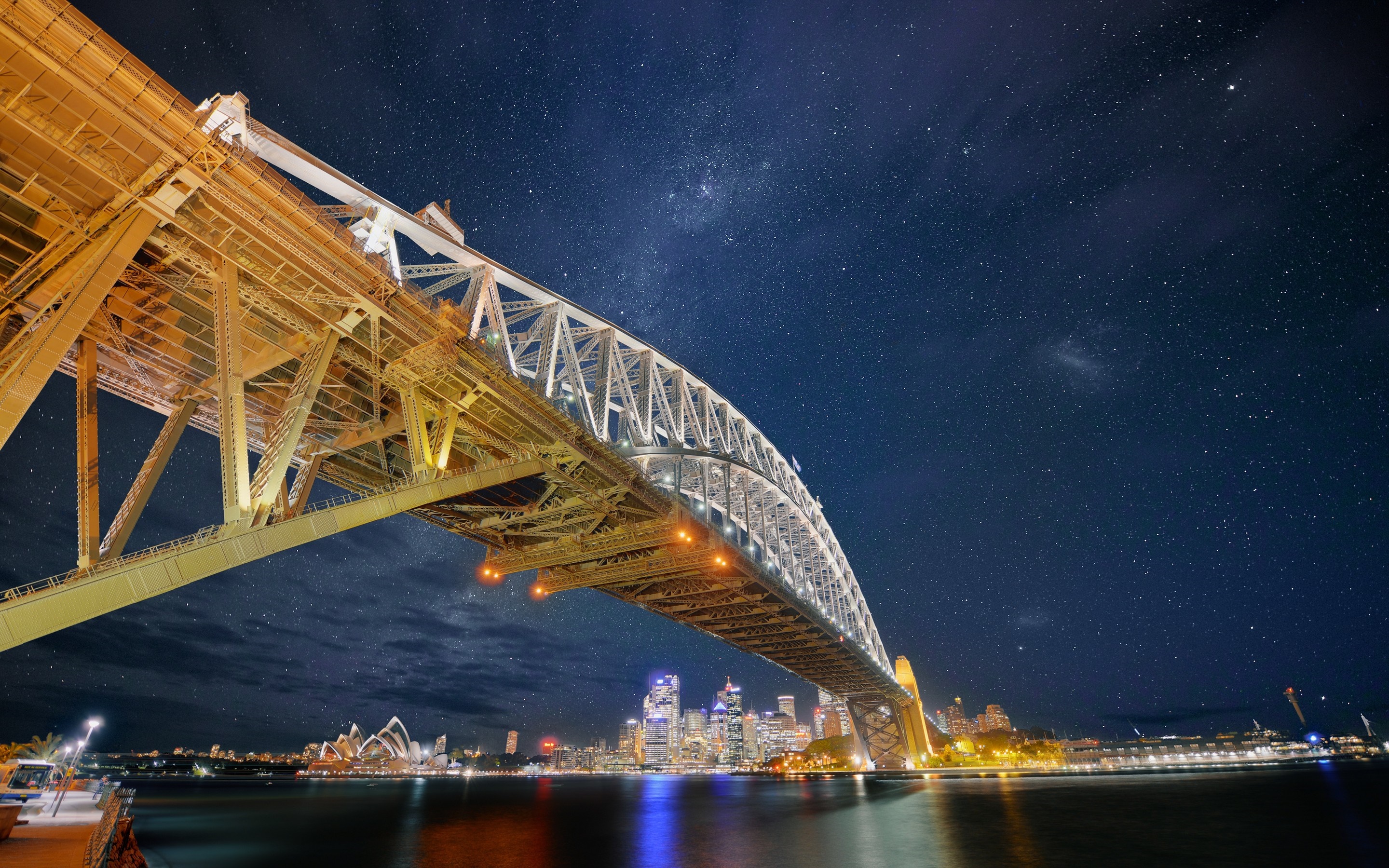 Sydney Harbour Bridge and Opera House at night with stars HD Wallpaper