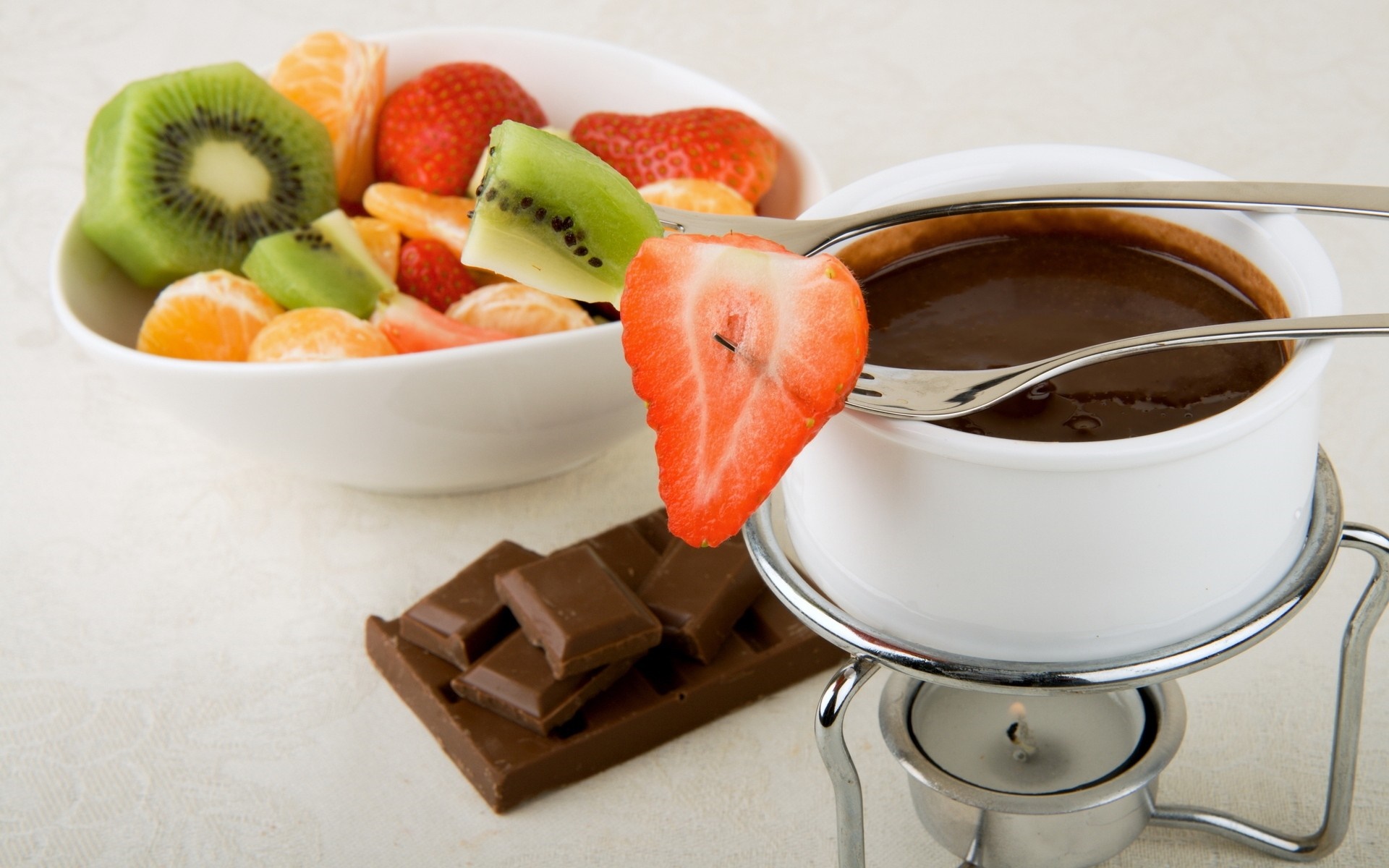 Chocolate fondue with fruit and chocolate bar HD Wallpaper
