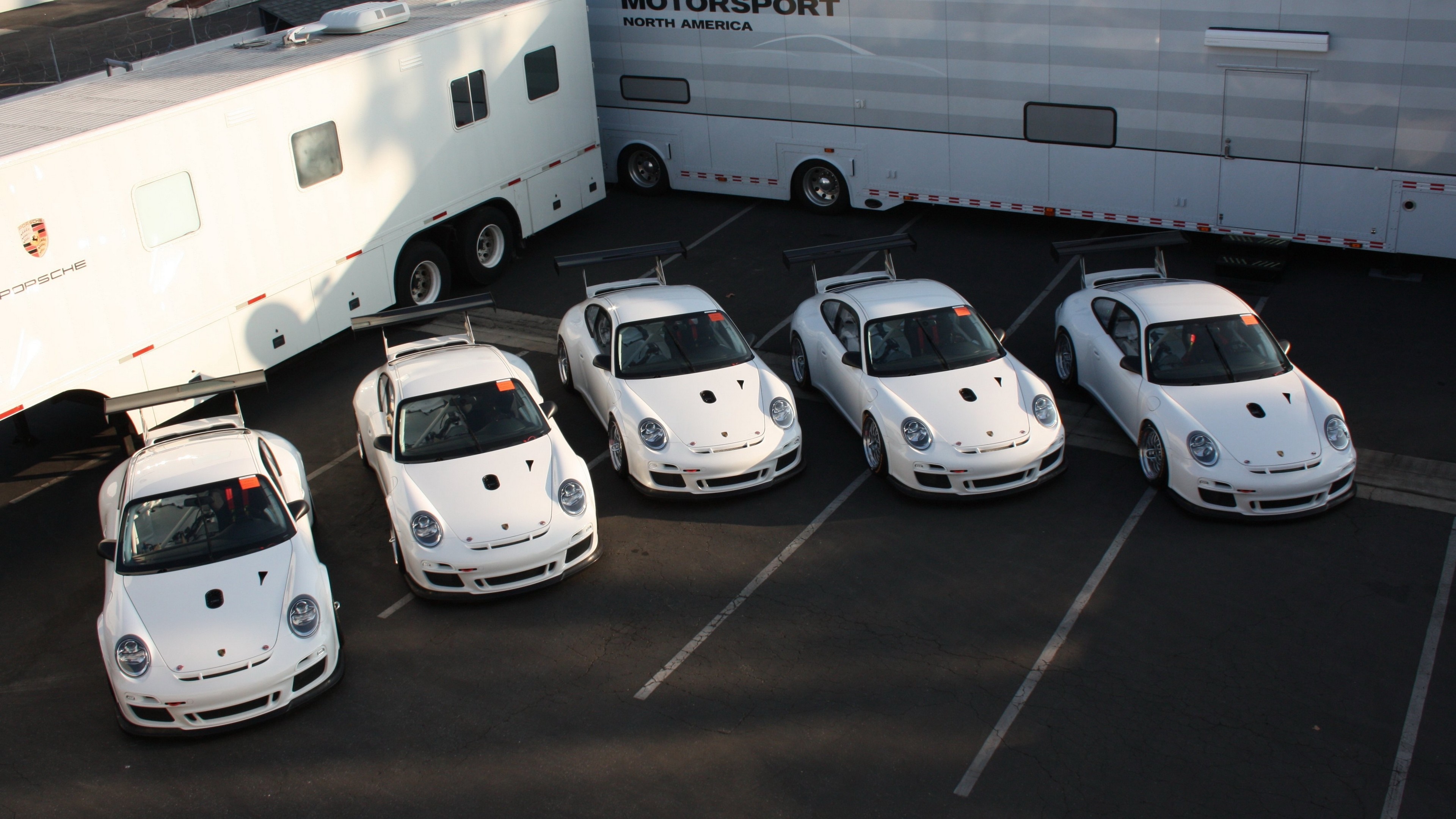Porsche race cars and trailers HD Wallpaper