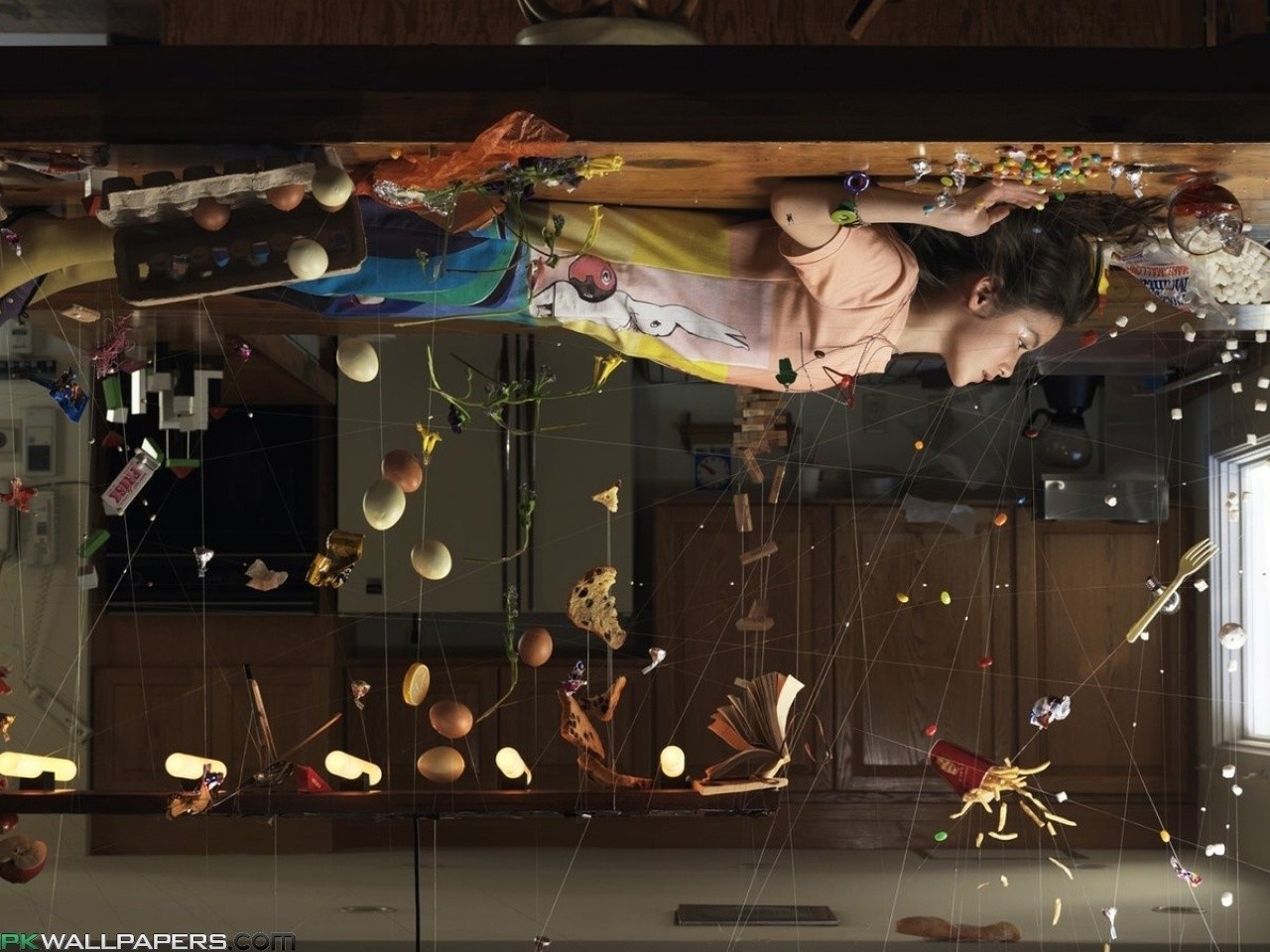Girl suspended by wires with floating food and eggs HD Wallpaper