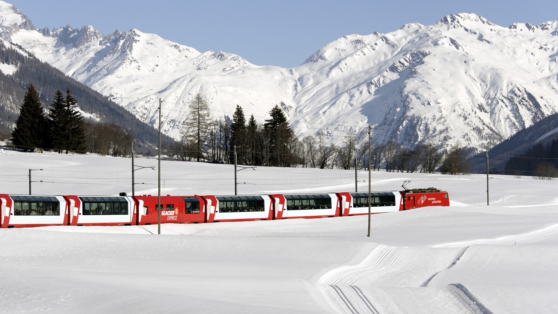 Glacier Express train in the Swiss Alps during winter HD Wallpaper
