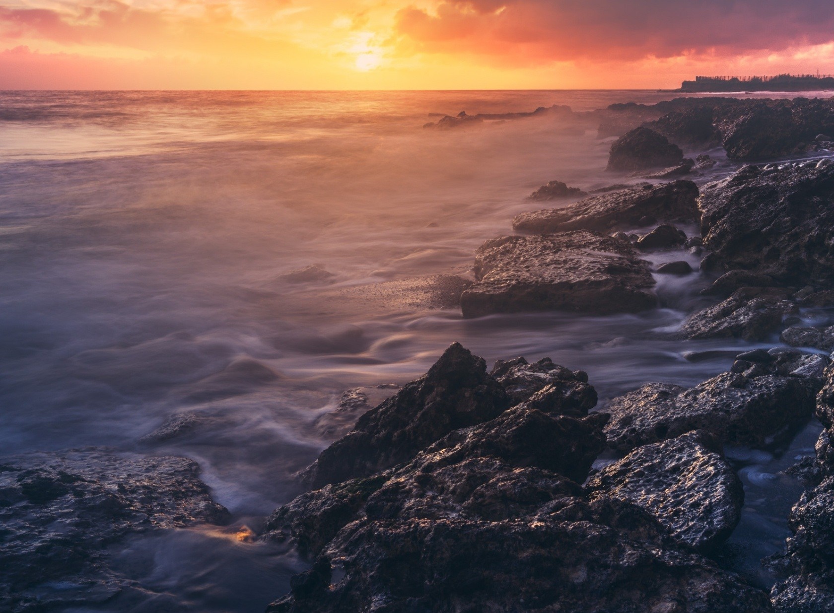 Sunset over rocky coast with ocean waves HD Wallpaper