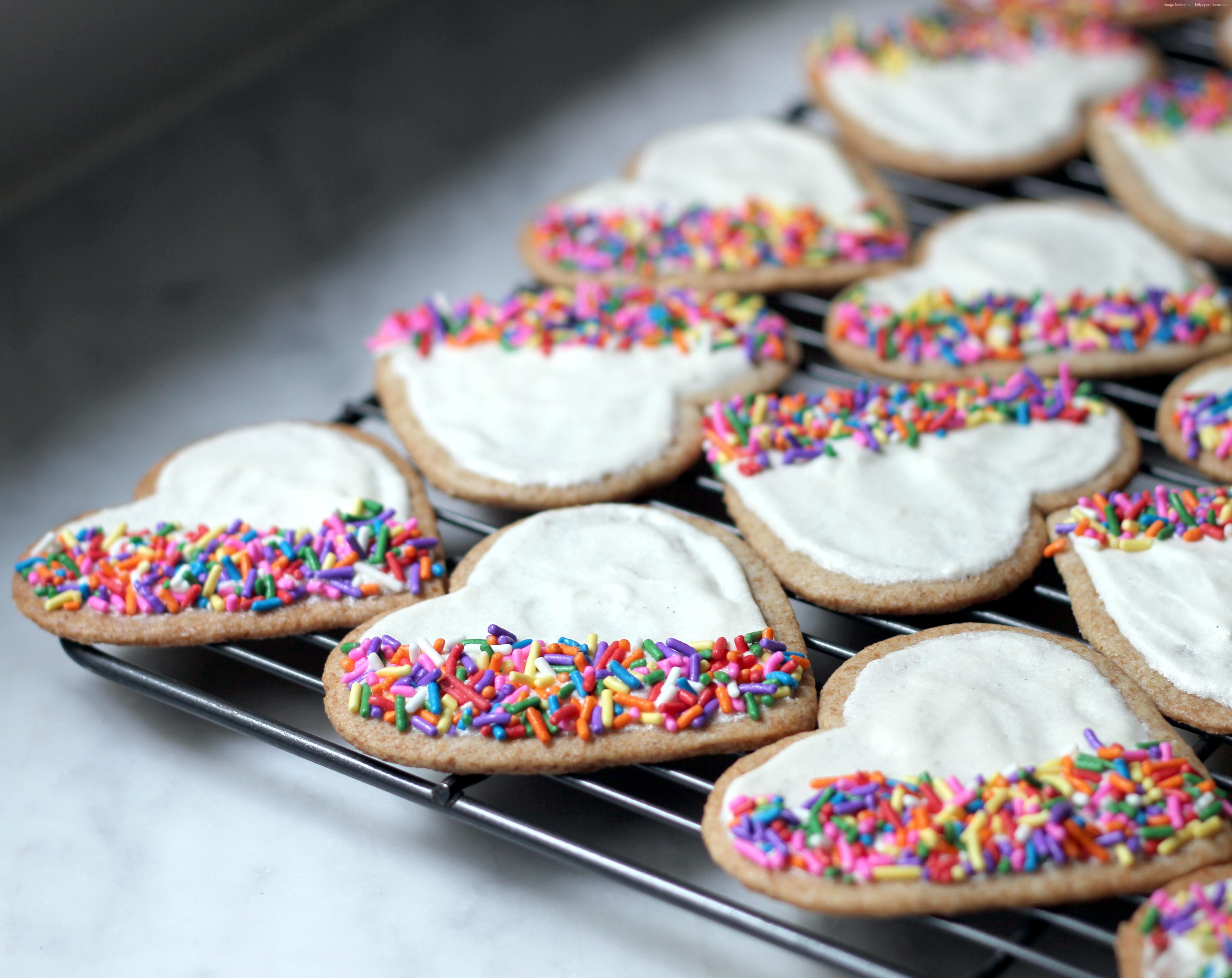 Heart-shaped sugar cookies with white frosting and sprinkles HD Wallpaper