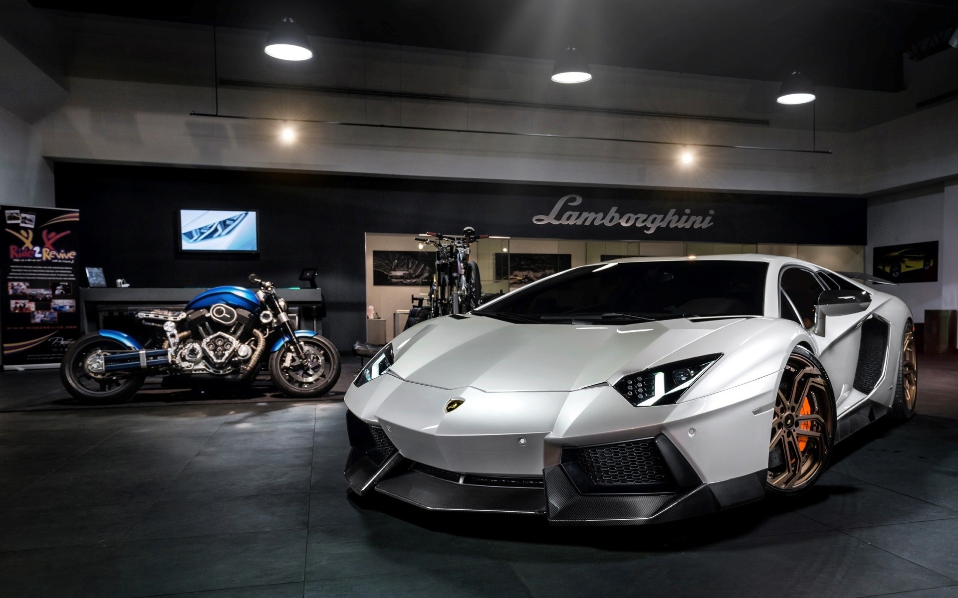 White Lamborghini Aventador and blue motorcycle in showroom HD Wallpaper