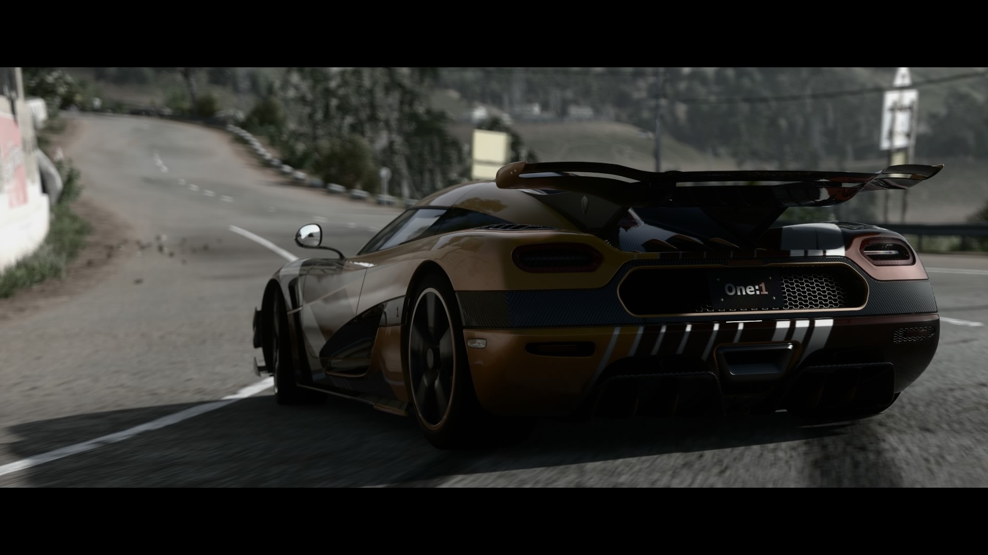 Koenigsegg One:1 sports car on a winding road HD Wallpaper