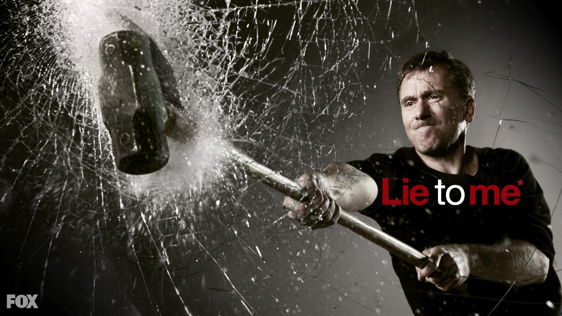 Tim Roth in Lie to Me smashing glass with a sledgehammer HD Wallpaper