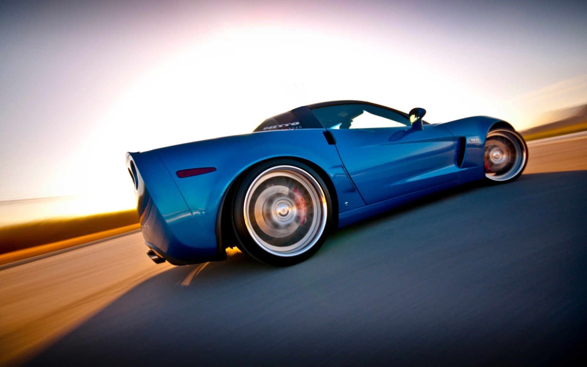 Blue Chevrolet Corvette sports car driving on road HD Wallpaper