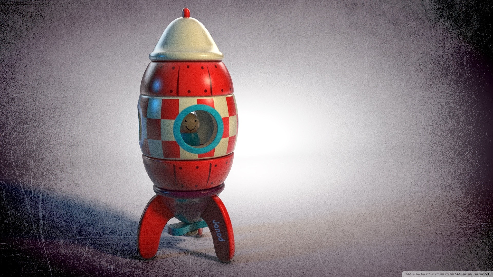 Red and white toy rocket with a smiling character HD Wallpaper