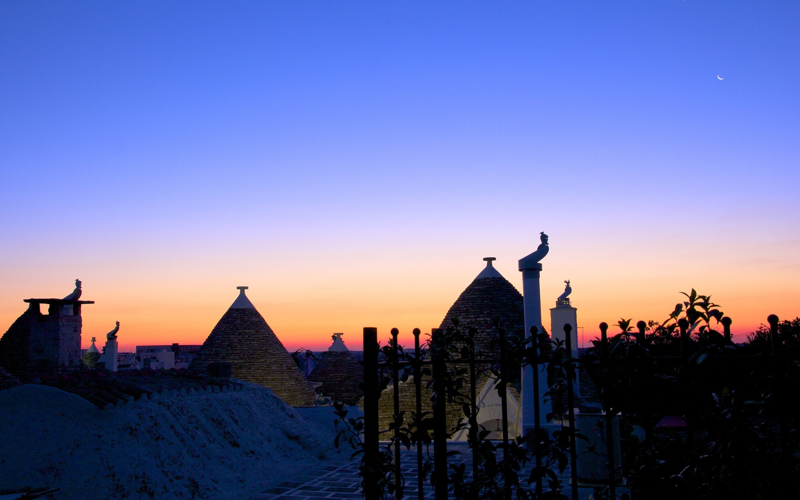 Trulli rooftops at sunset in Alberobello, Italy HD Wallpaper