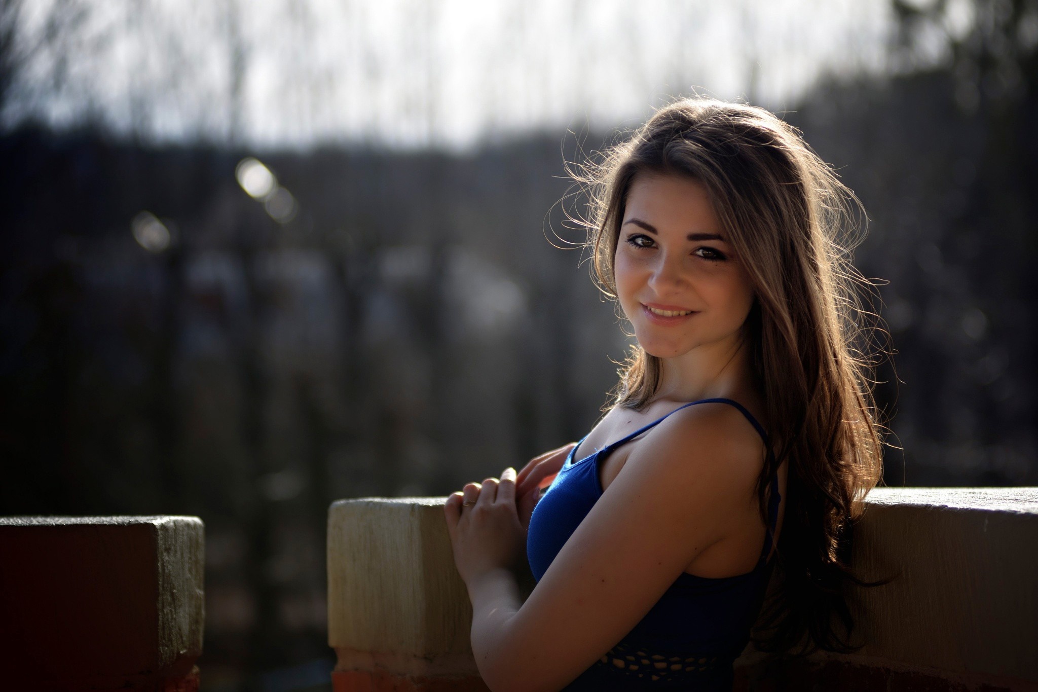 Woman in blue dress posing outdoors HD Wallpaper
