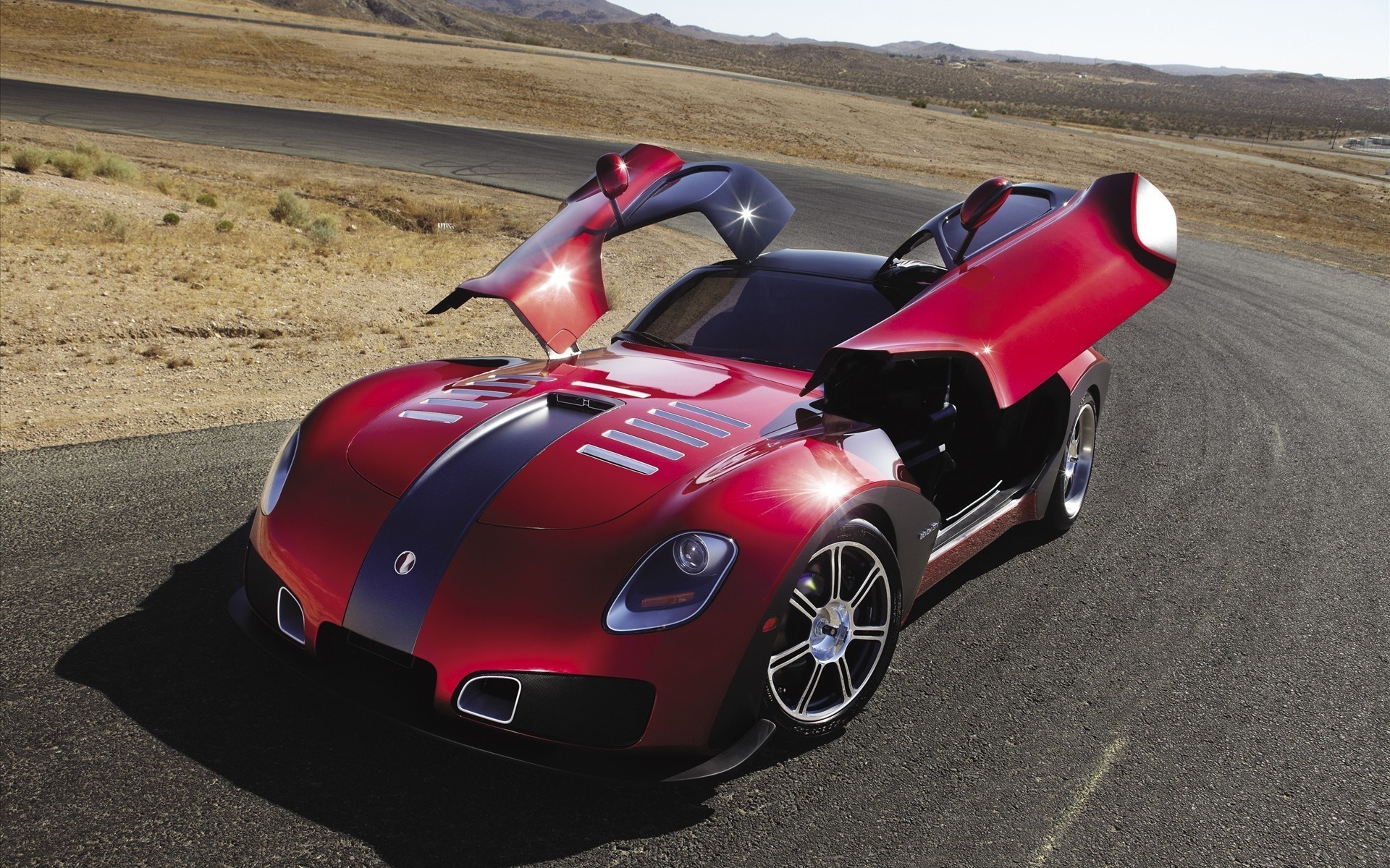 Red Devon GTX sports car with doors open on a road HD Wallpaper