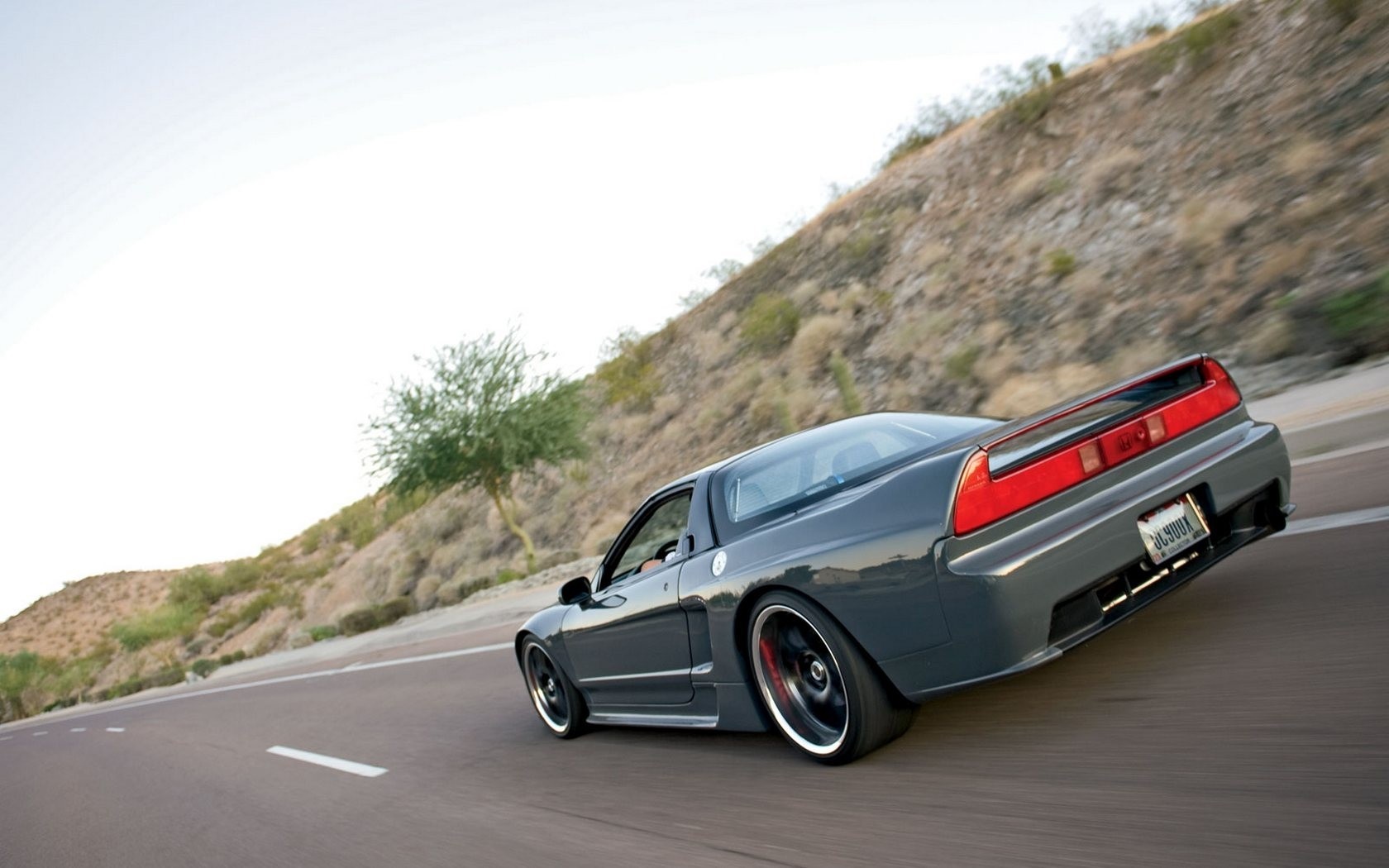 Gray Honda NSX driving on a road HD Wallpaper