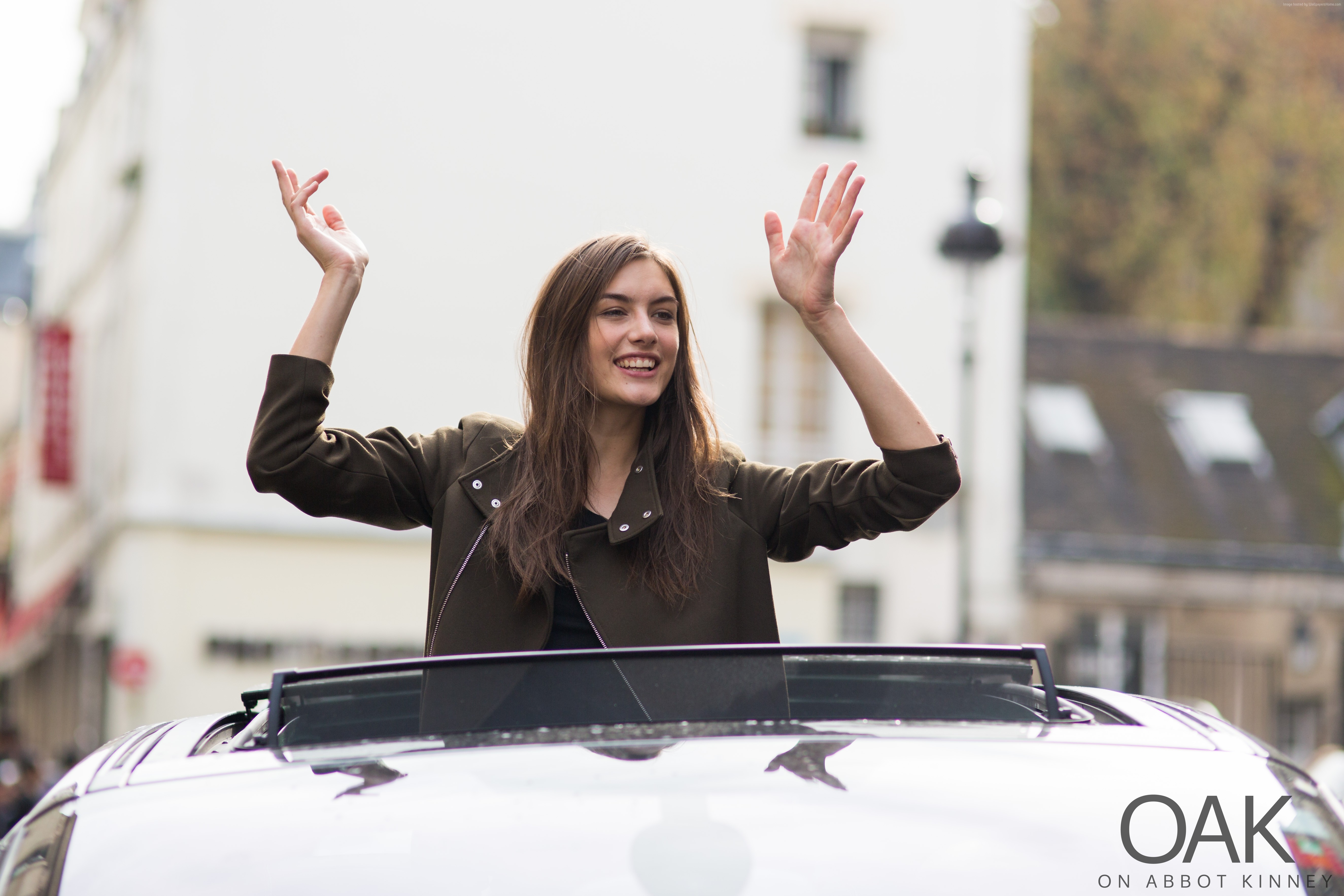 Ronja Furrer in a car with arms raised HD Wallpaper
